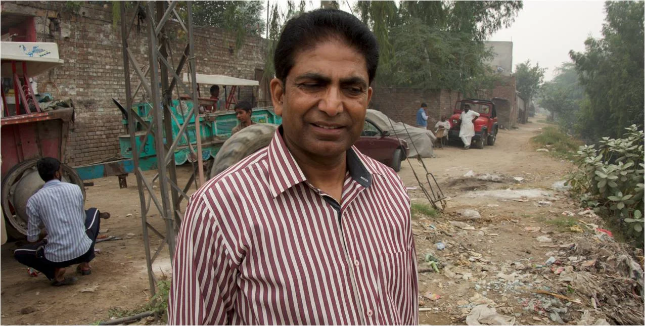 Here is Pastor John Iqbal on a local street where he picks up some of his students and brings them to school. None of them have transportation, but Pastor John is dedicated to providing this service for them.