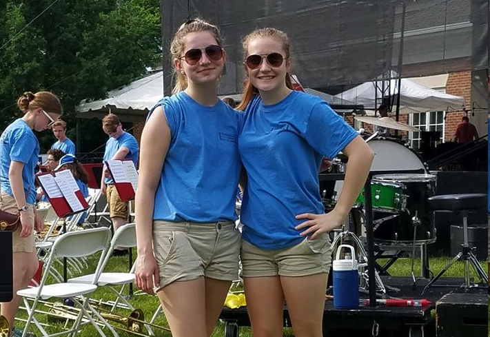 Some members of the trombone section pose for a candid photo before the Memorial Day Concert 2018!