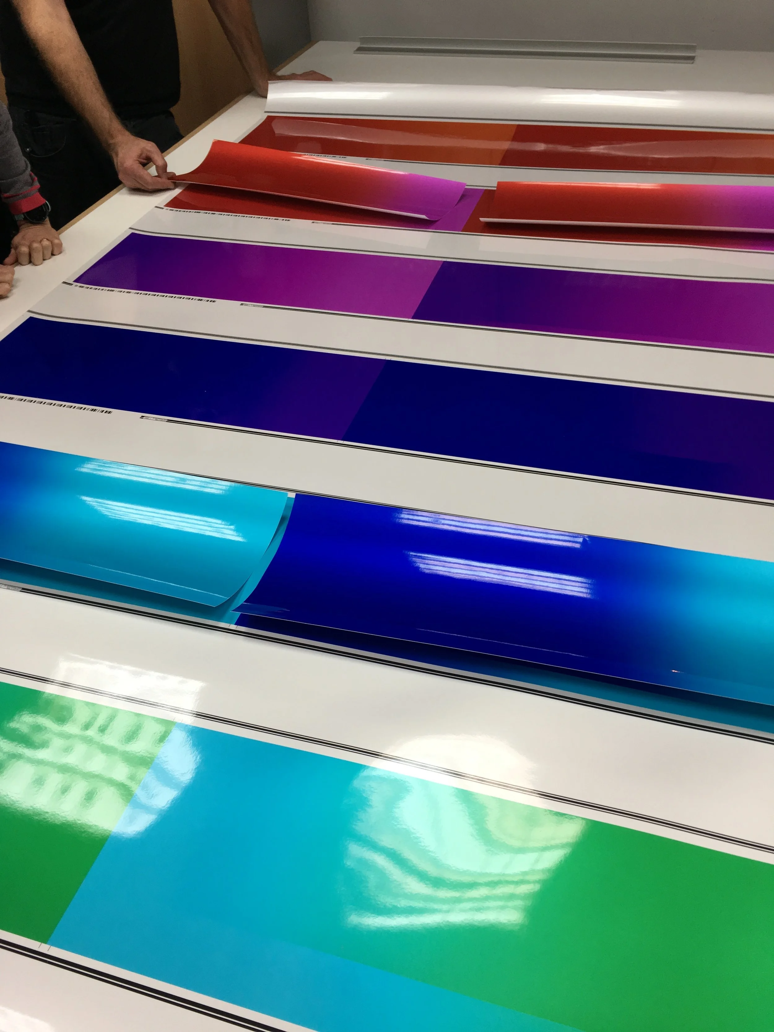 Proofing of the prints taking place at Genesis Imaging