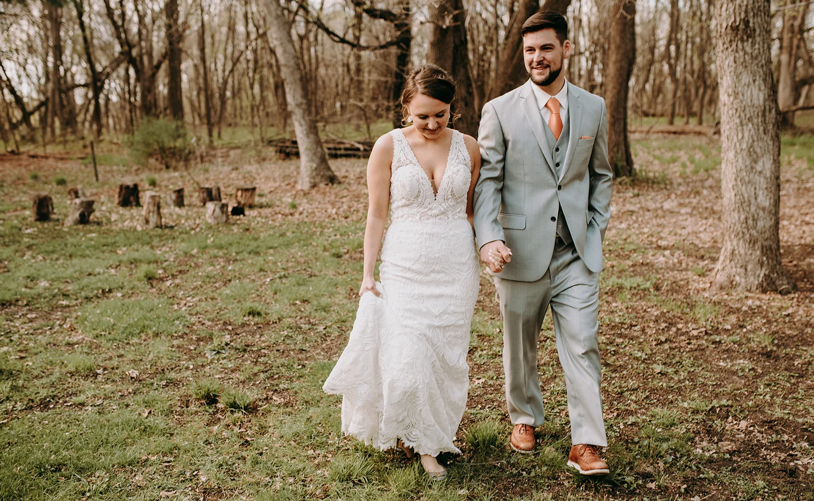 Bride & Groom Walking in the Woods.jpg