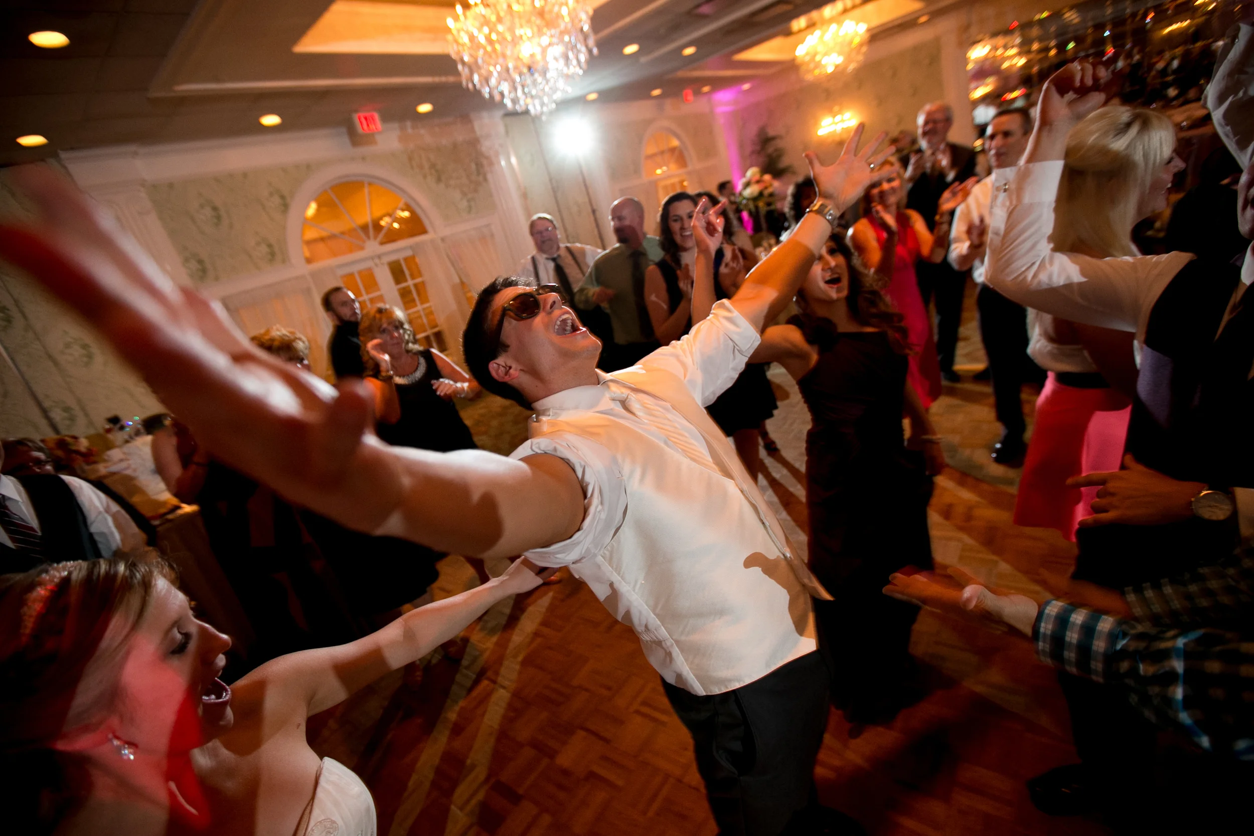 Groom dancing at reception