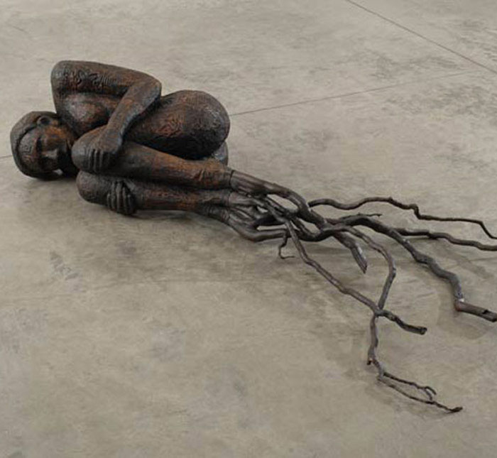 ALISON SAAR Bare Root , 2007 Wood, bronze, ceiling tin and tar 17 x 81 x 48 inches