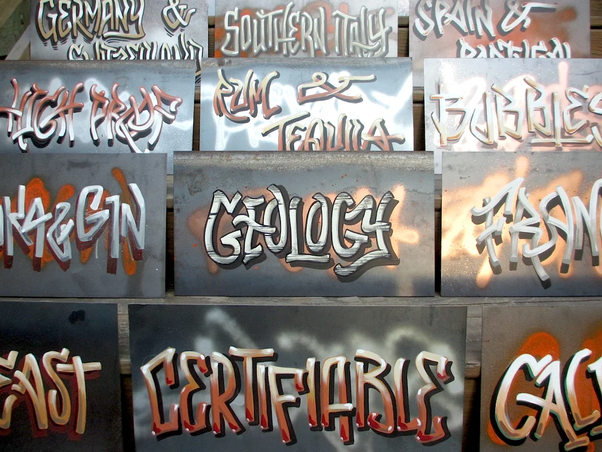  SPRAY PAINT AND ENAMEL GRAFITTI ON ALUMINUM SHEETING.  SIGNAGE FOR NEW YORK CITY WINE SHOP. 