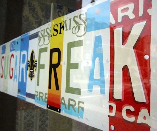  LICENSE PLATE STYLE RESTAURANT SIGN PAINTED IN REVERSE.  OIL ENAMEL ON GLASS.   