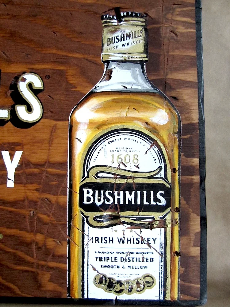  DETAIL OF BUSHMILLS PROMOTIONAL SIGNS.  200 WOODEN SIGNS HAND-CUT AND DISTRESSED, STAINED AND SCREEN-PRINTED WITH INDIVIDUAL HAND-PAINTED COLOR AND DETAILING. 