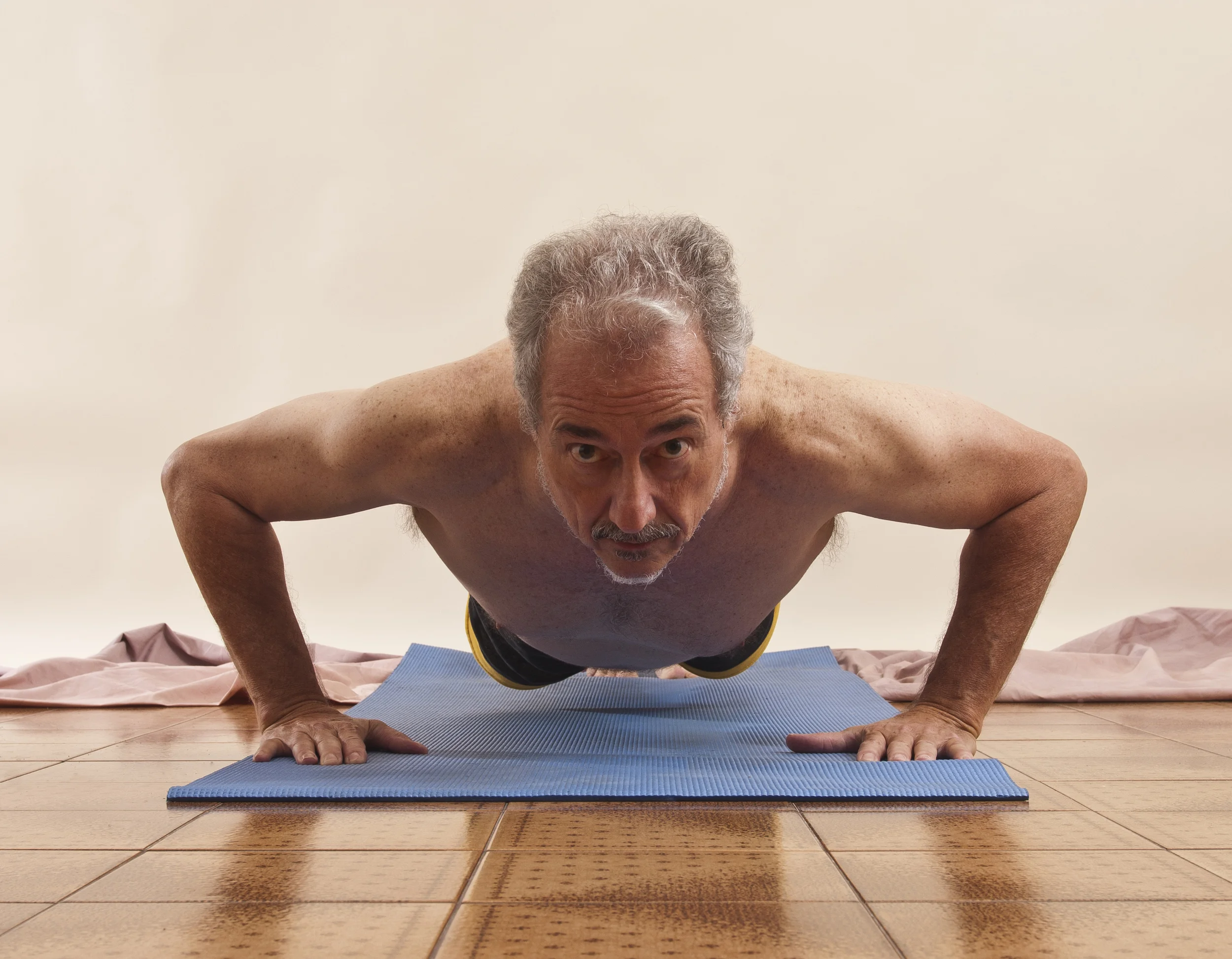 grey haired man push up staring at camera.jpg