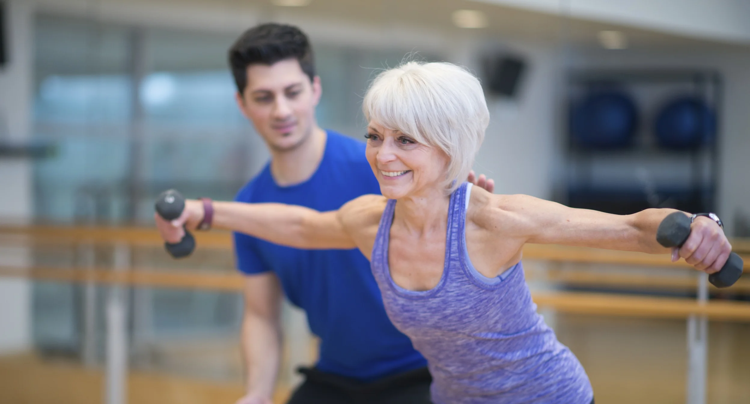 lean platinum woman with male trainer.jpg