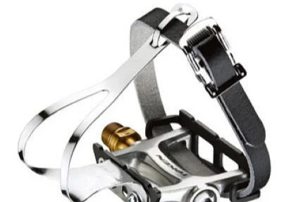 Pedal with toe clip and strap