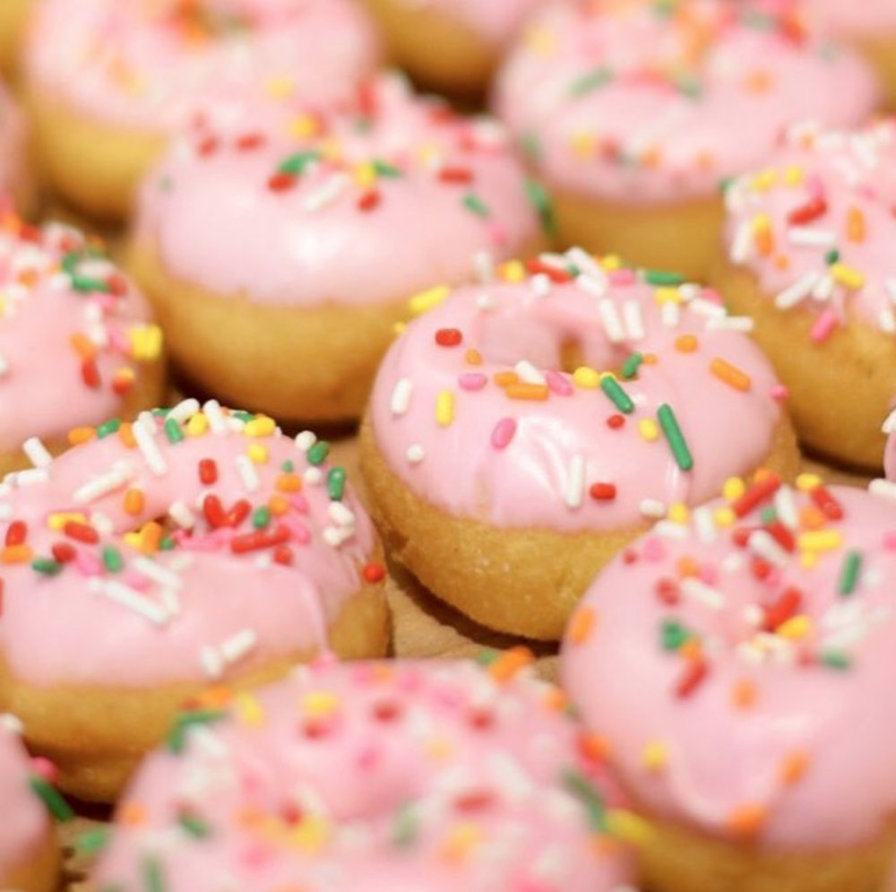 Homer - Pineapple-hibiscus icing, sprinkles. Our best selling donut!