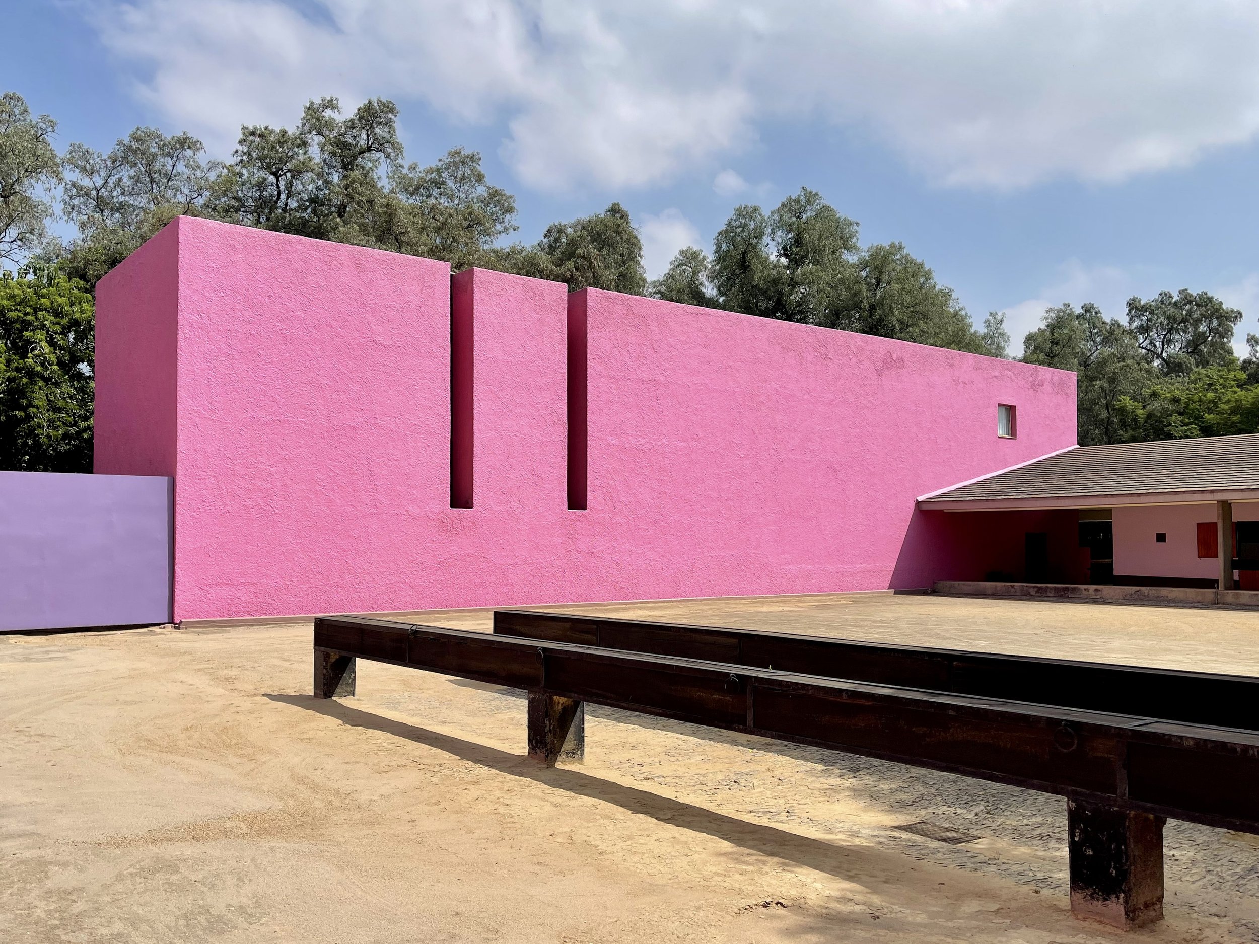 Pink back wall of Cuadra San Cristobal