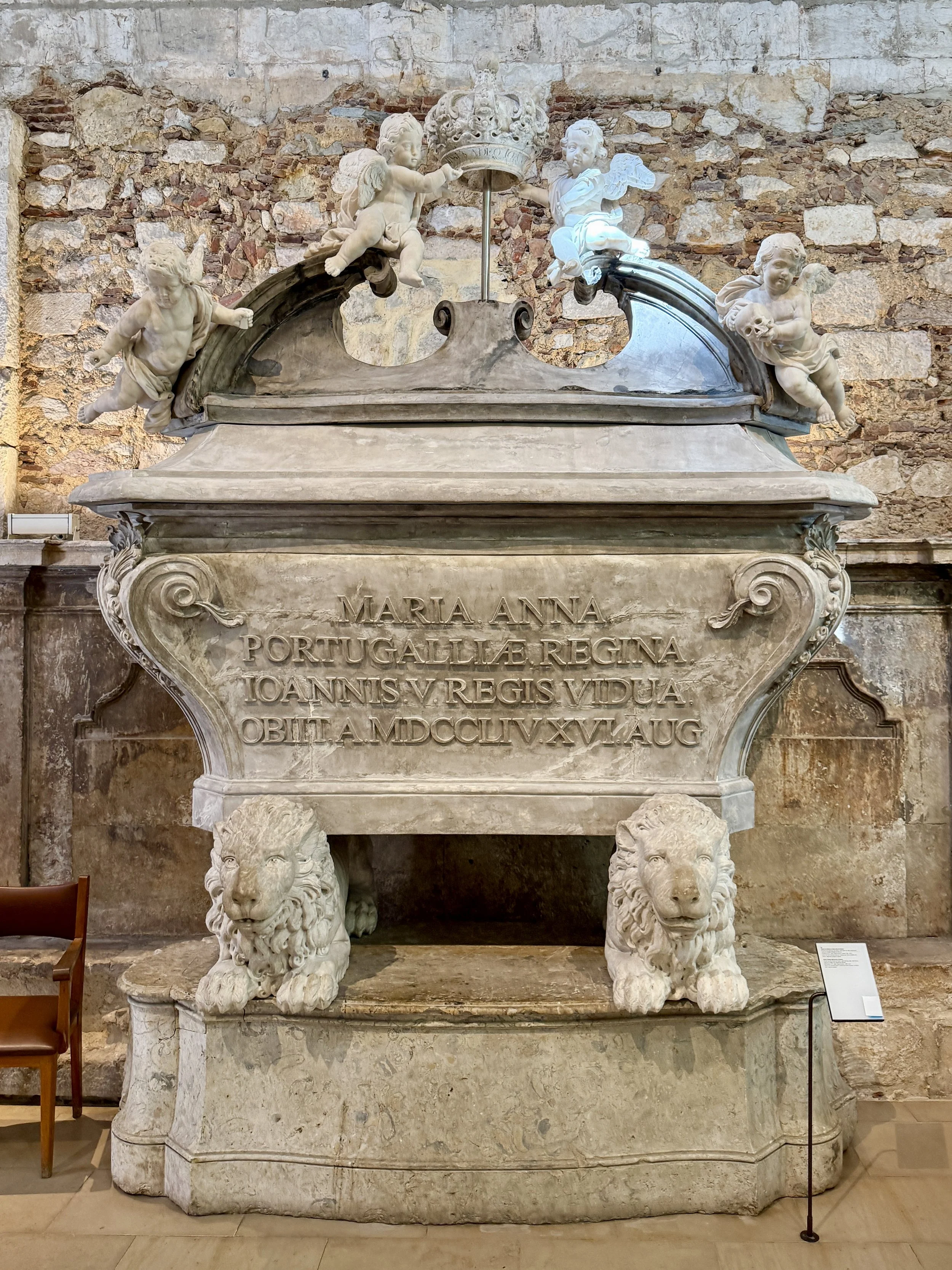 Winged putti, watchful lions and memento mori symbols adorn the elaborate tomb of Queen Maria Ana de Áustria at the Cartmo Archeological Museum in Lisbon