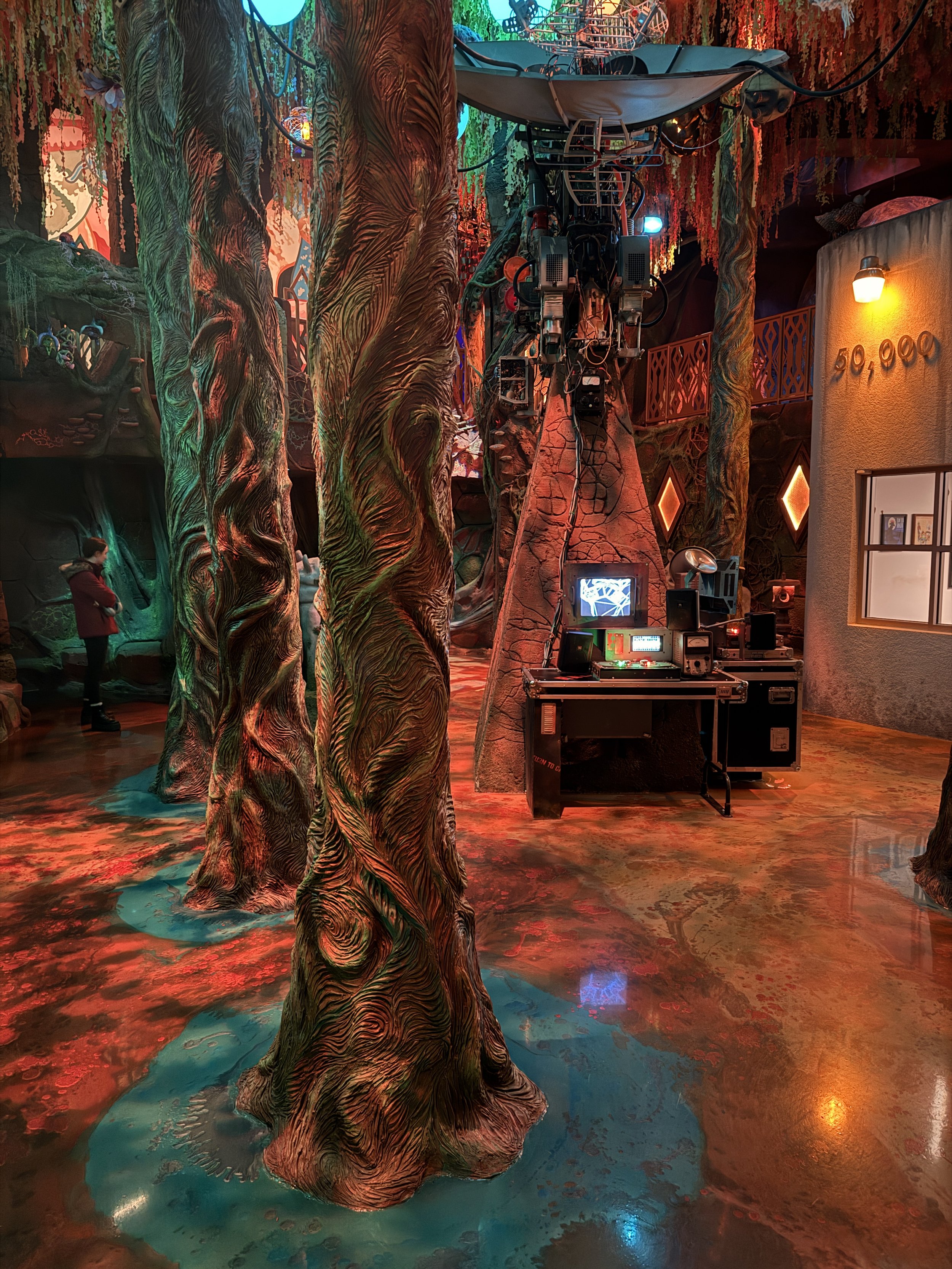 Strange trees and computer stations at Meow Wolf Radio Tave in Houston, Texas