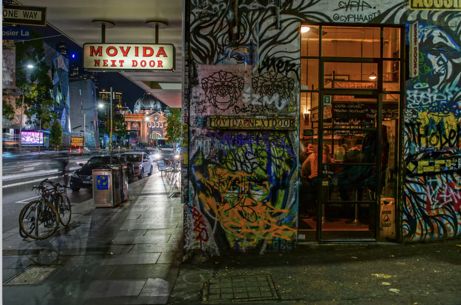 Grafitti-covered exterior of Movida restaurant in the Laneways of Melbourne, Australia