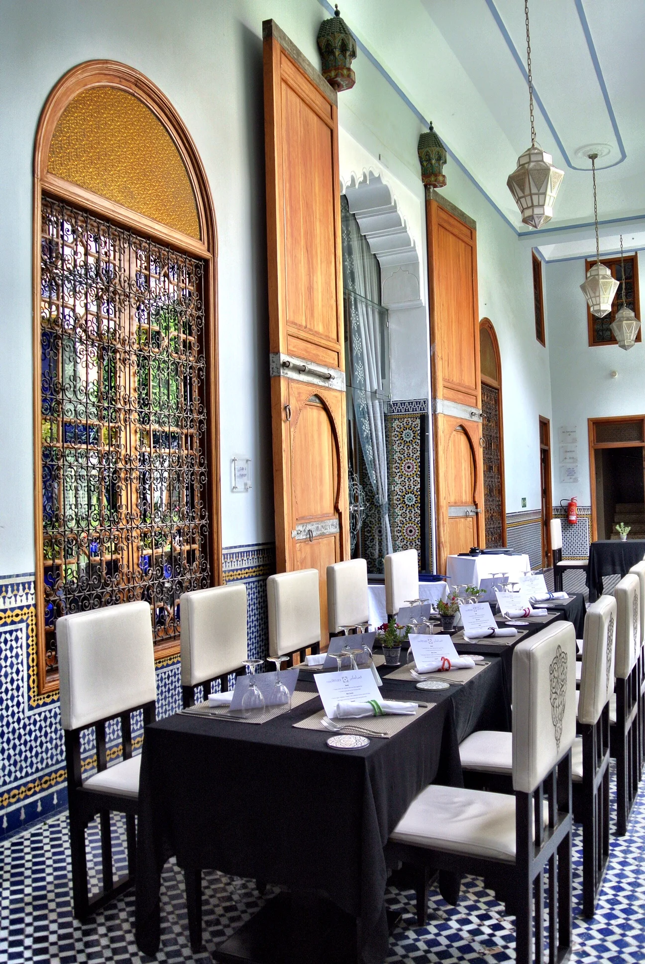 The tree-filled courtyard is a tranquil setting for a pleasant meal