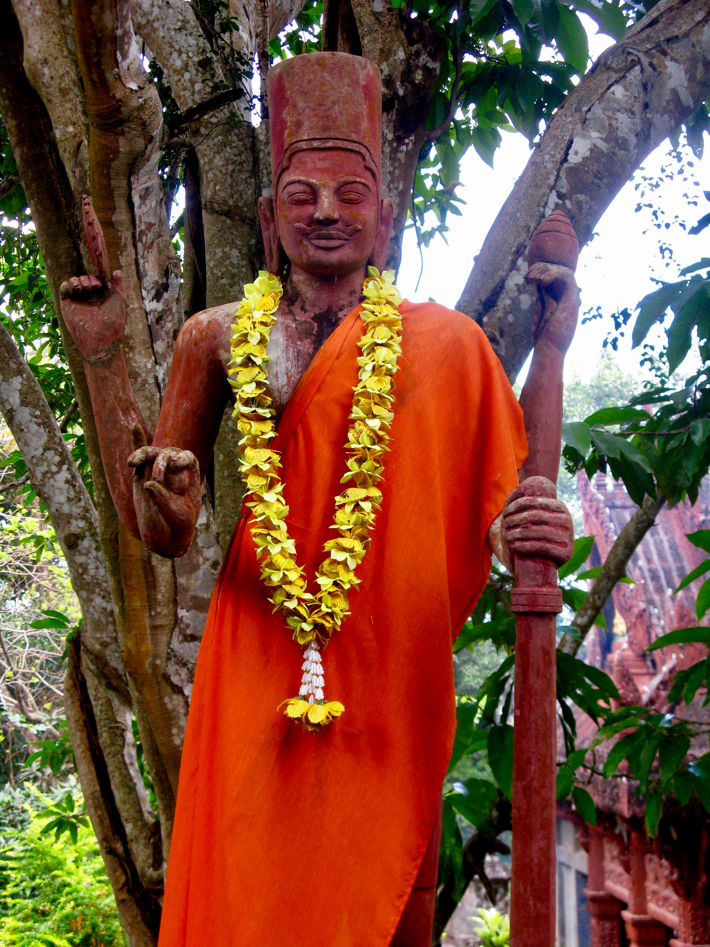   A statue of Vishnu draped in saffron cloth  