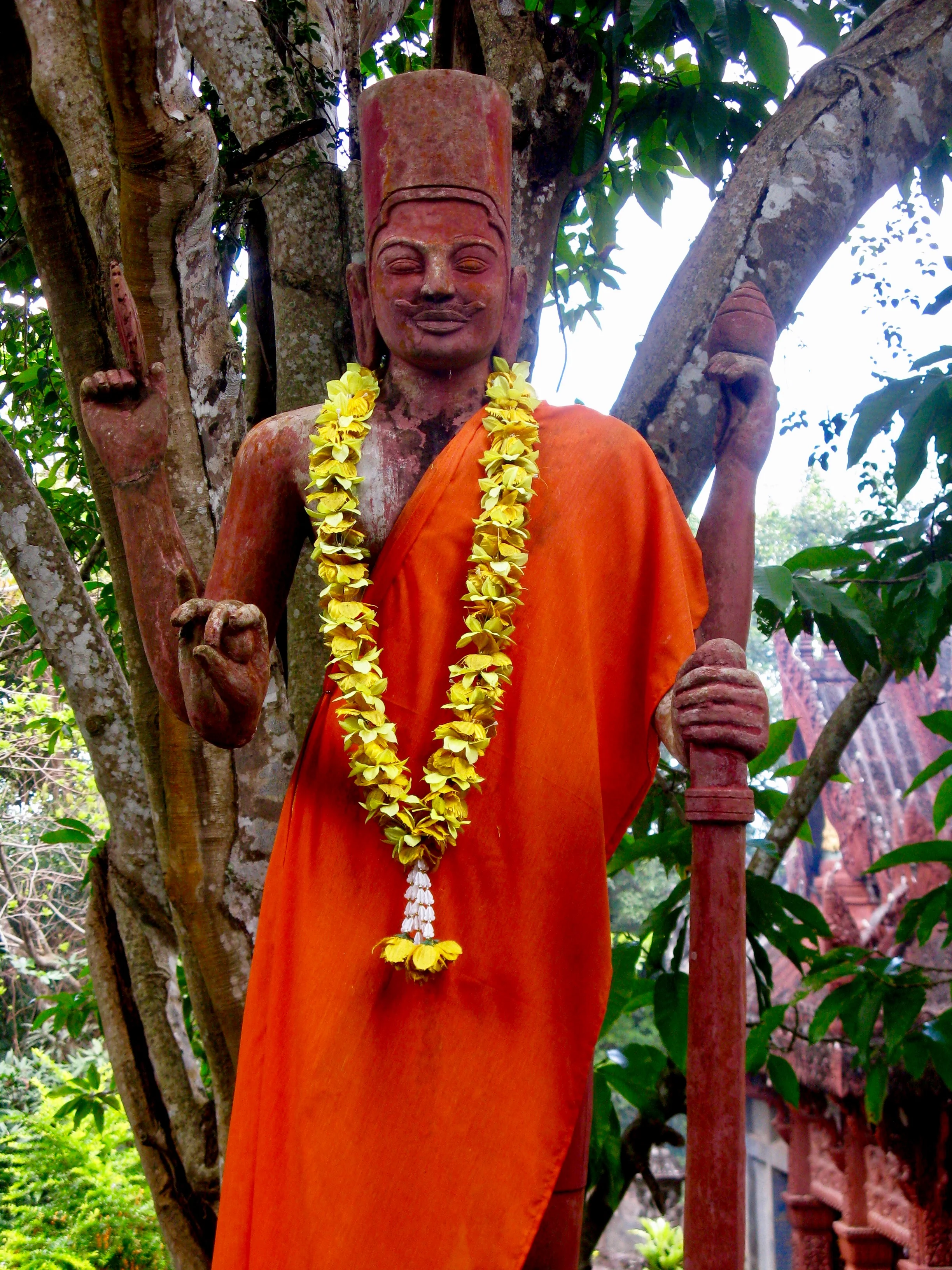A statue of Vishnu draped in saffron cloth