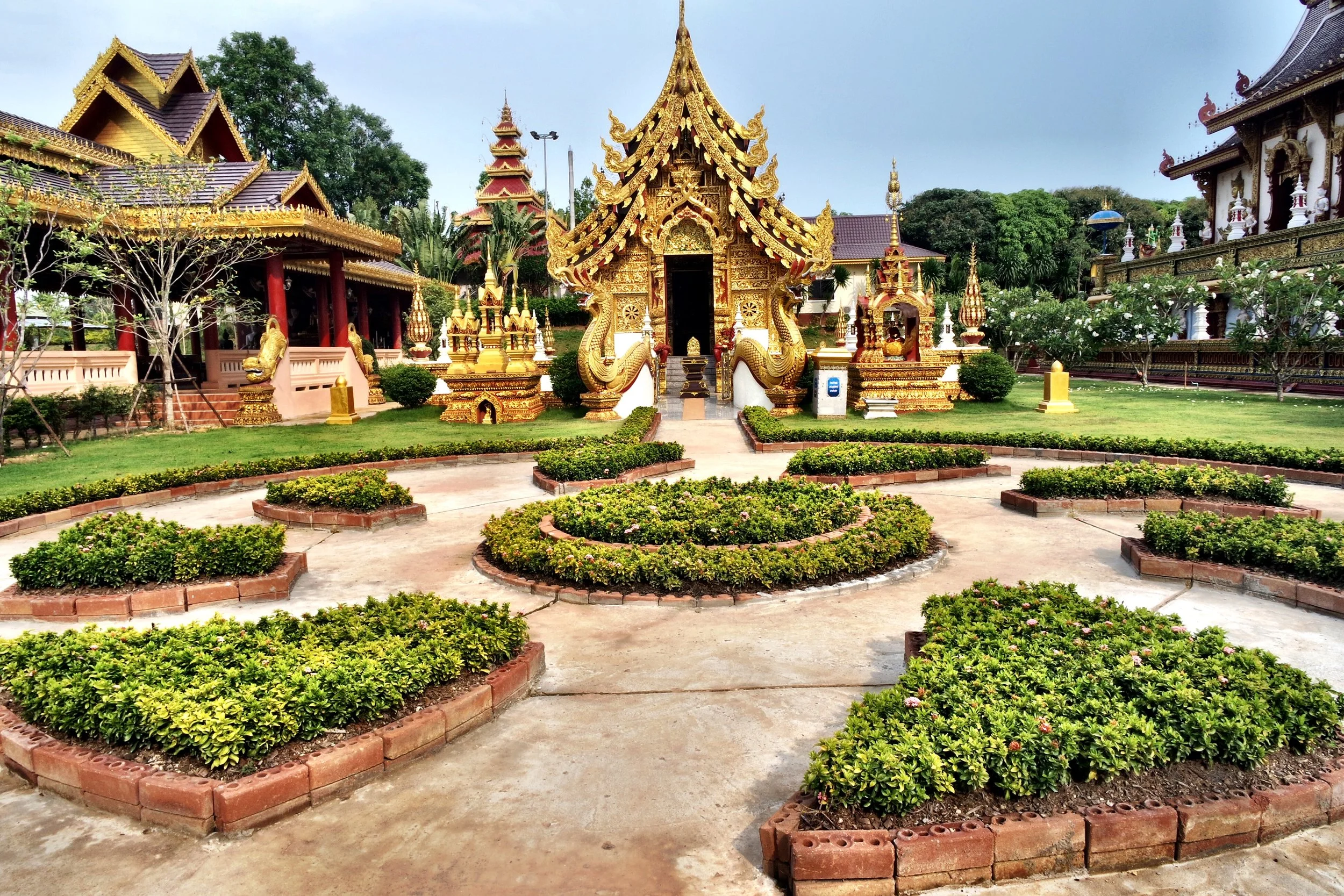 The front area of Wat Sang Kaew is gorgeously landscaped