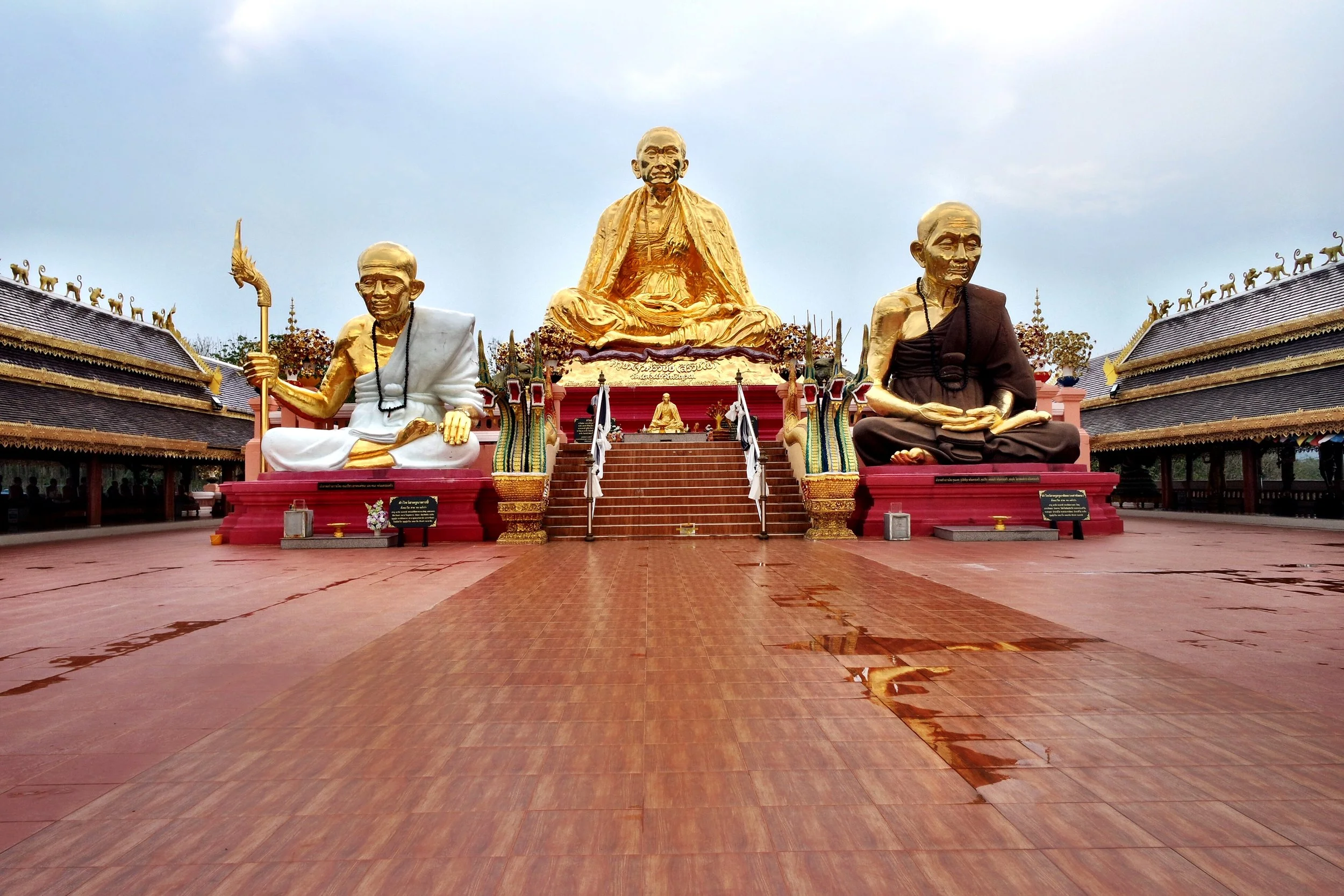 Three large golden monks sit atop the back of the complex. The guy in the middle is the Engineer Monk, who’s famous around these parts