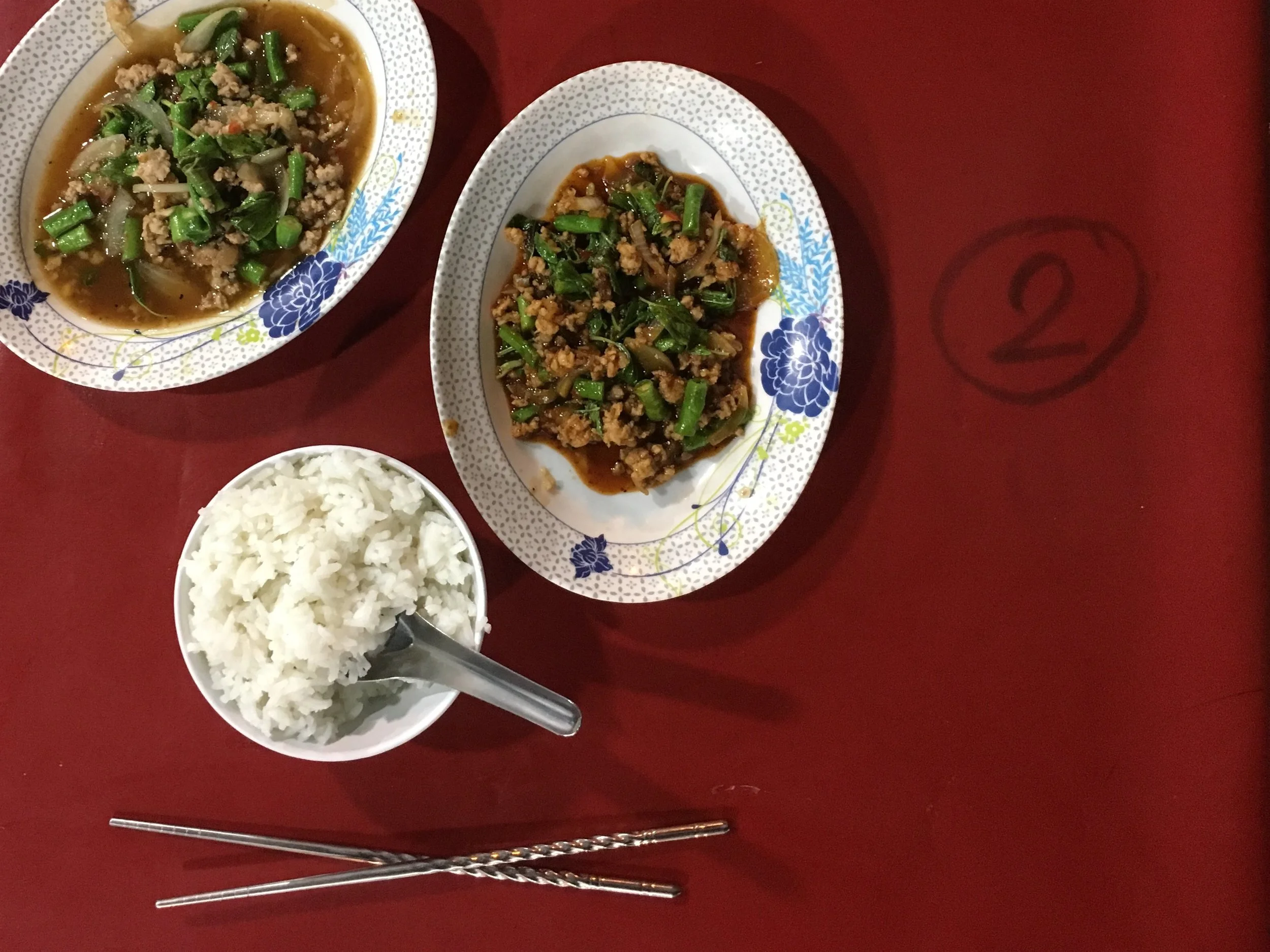 Pad prik gaeng with long beans and rice from a stall along the street in Chiang Mai, Thailand