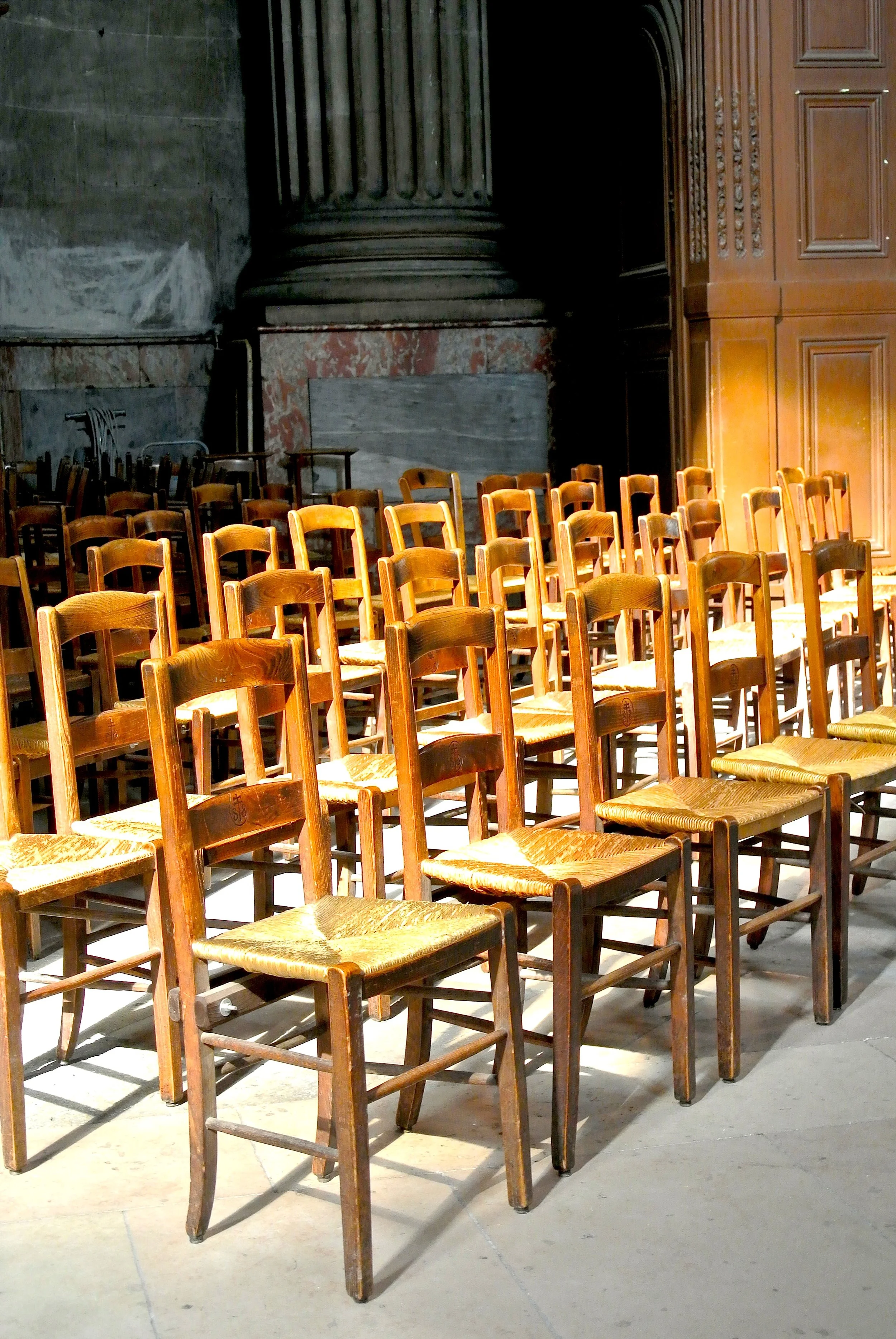 …just row after row of small wooden chairs.