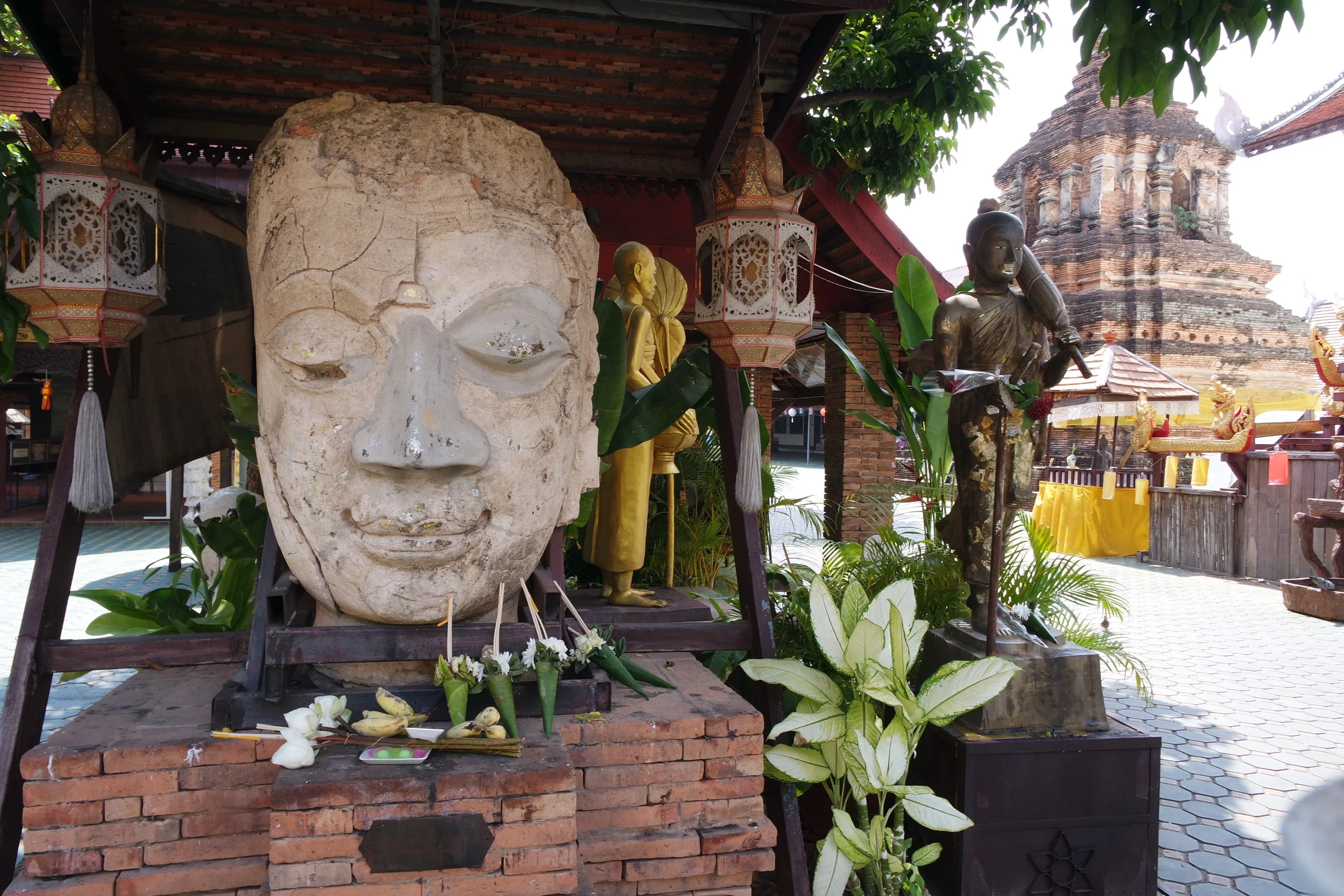 A giant Buddha head greets visitors to Wat Jetlin