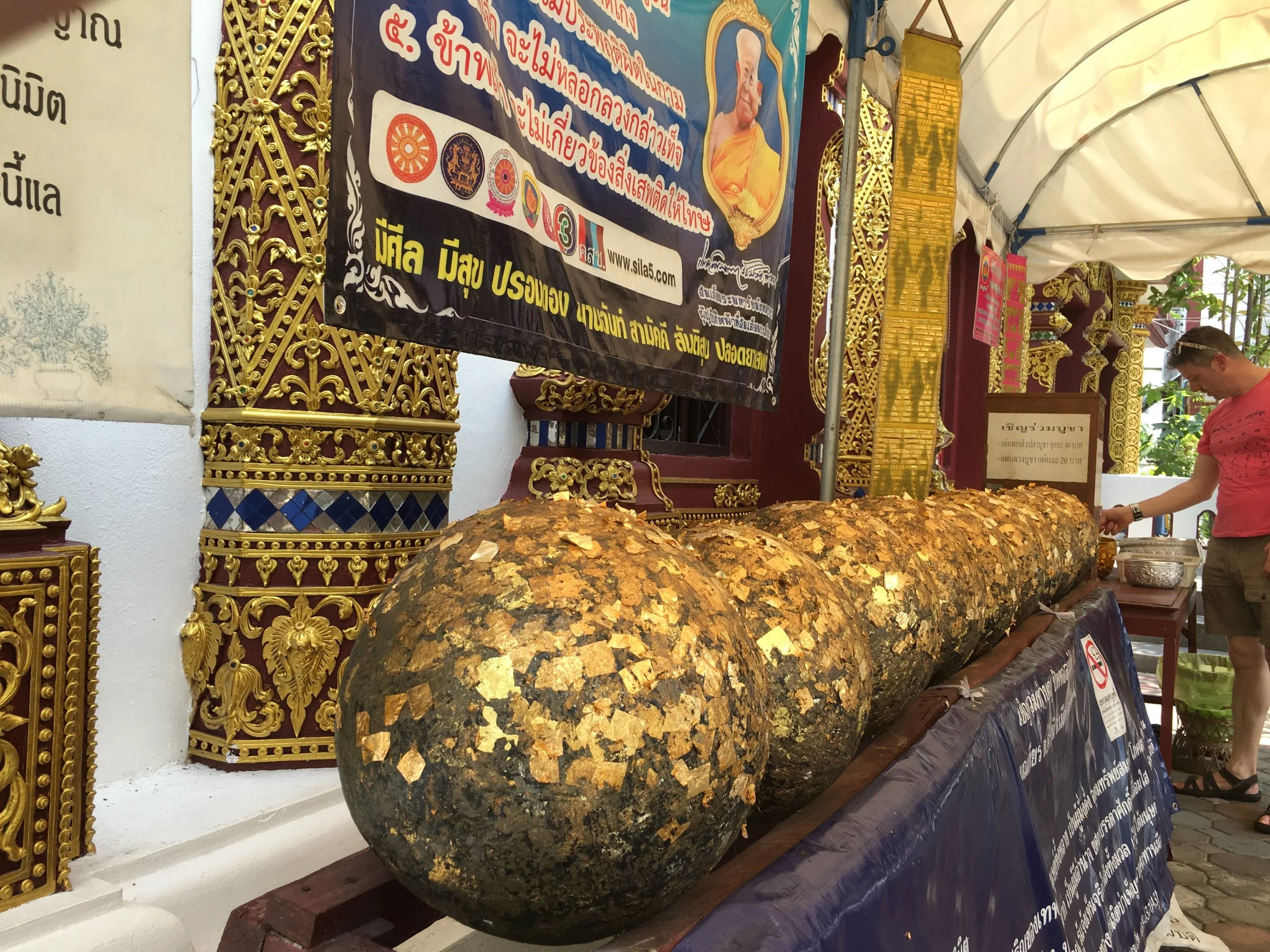 These balls, known as luk nimit, are usually buried under an image of the Buddha