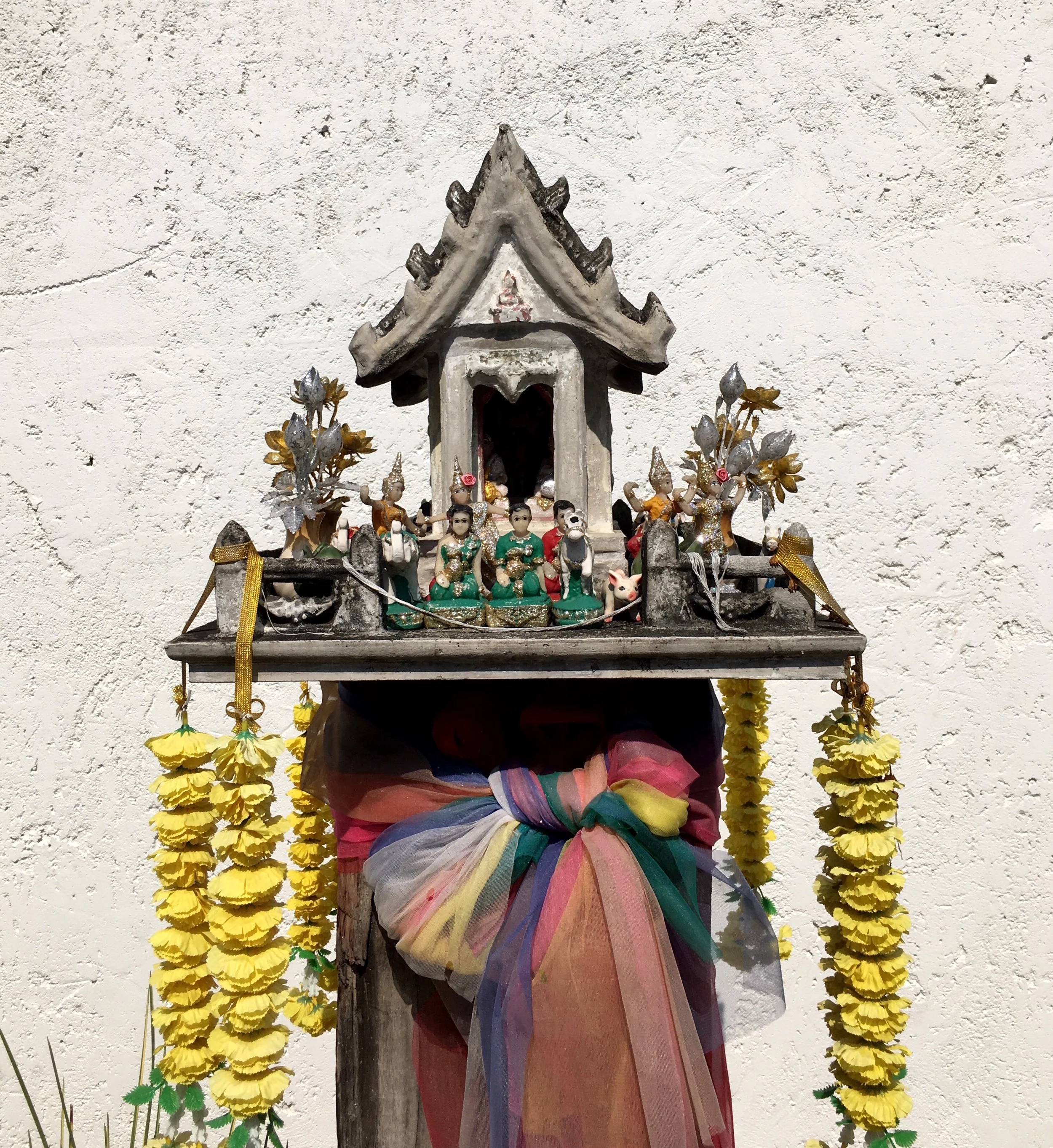 Spirit houses, known as san phra phum, are small shrines that provide a home for guardian spirits. Every home and most businesses in Thailand have one
