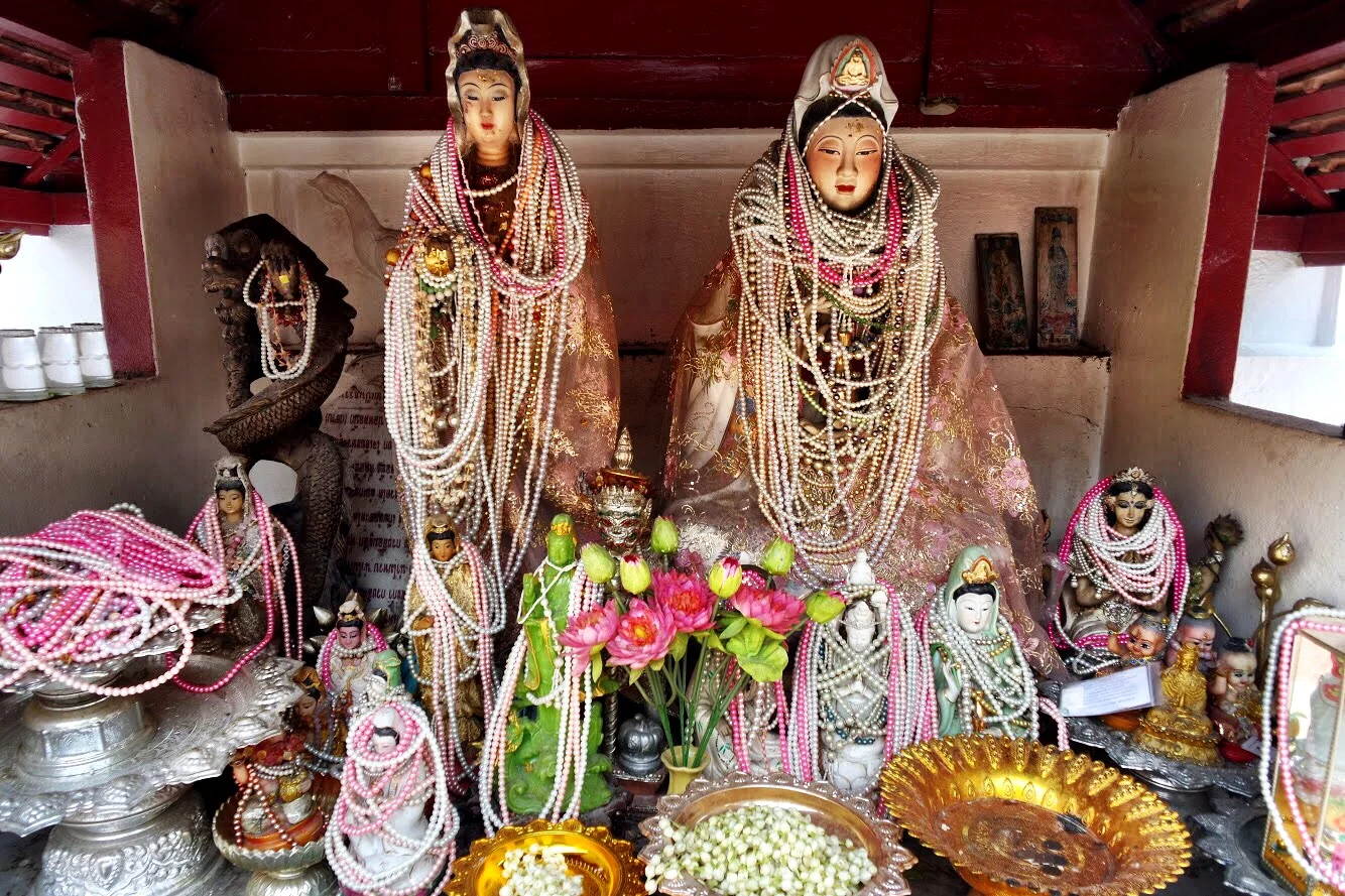The goddess of compassion, Kwan Yin, and her handmaidens accessorize with white and pink necklaces. They just can’t get enough!