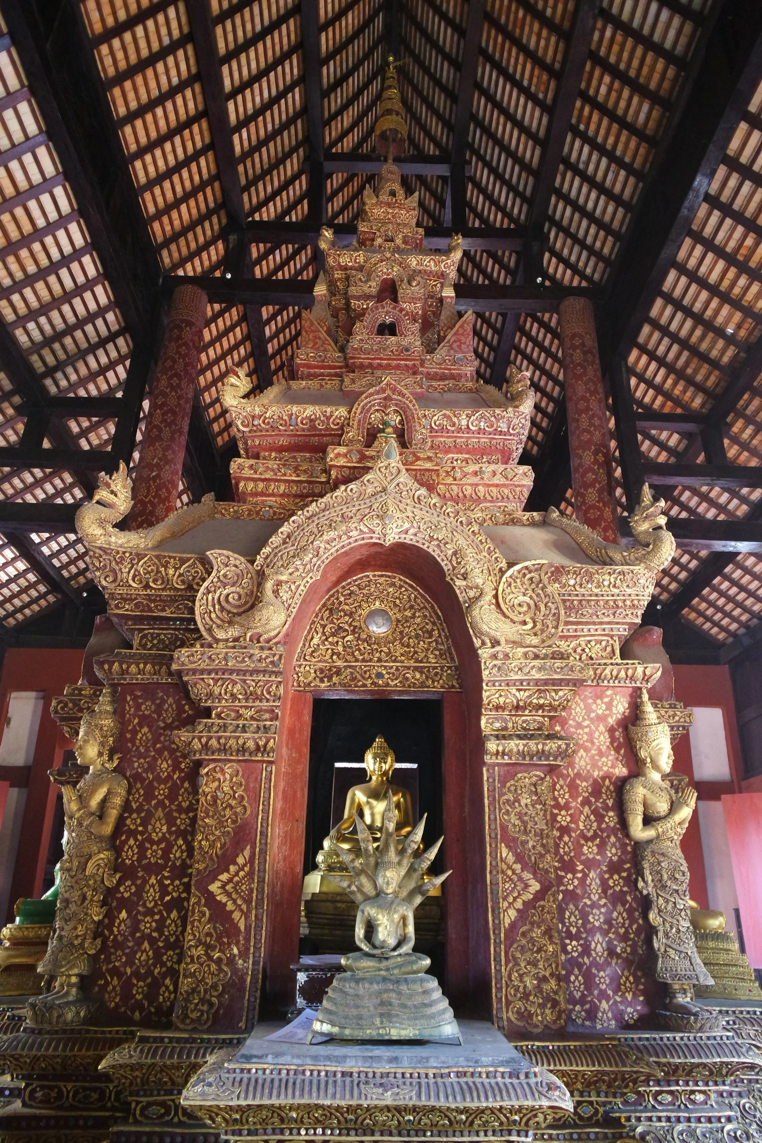 A gorgeously gilded multi-story altarpiece