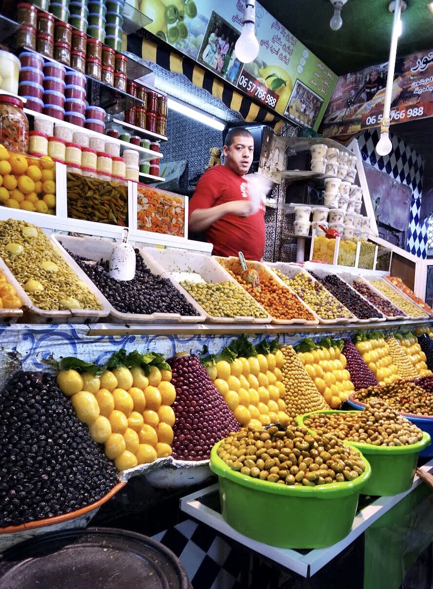The market displays, like those of this fruit and veggie vendor, are works of art and riots of color