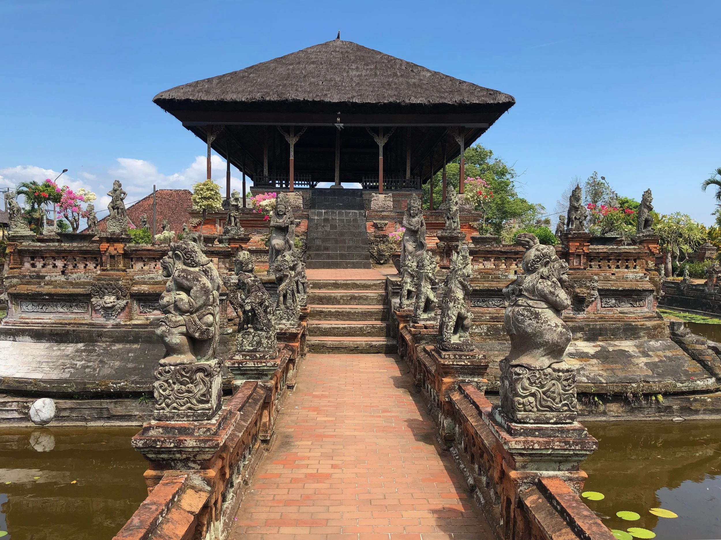 A brick path forms a bridge to access the Floating Pavilion