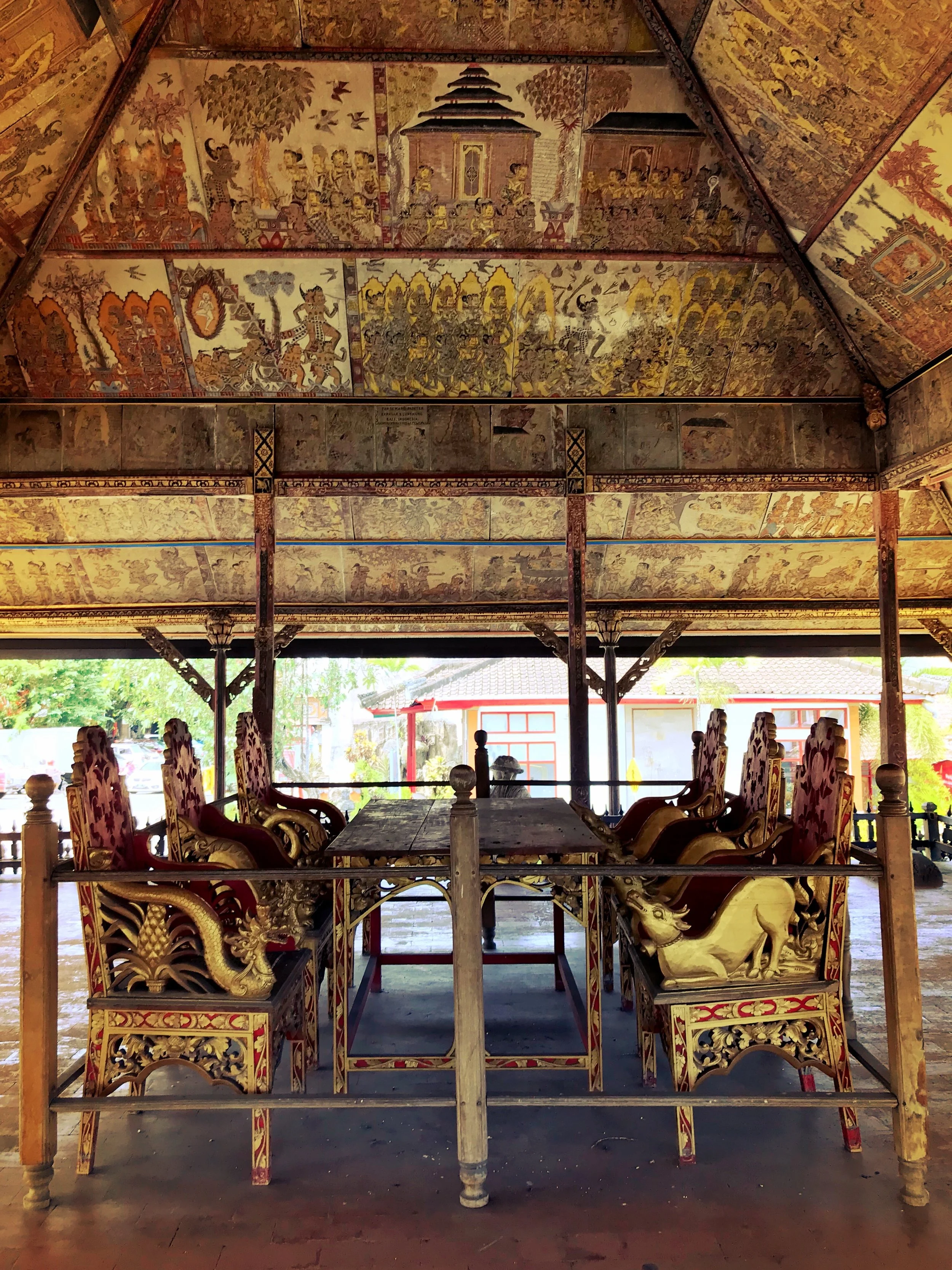 A lion, dragon and cow decorate the chairs in the Hall of Justice