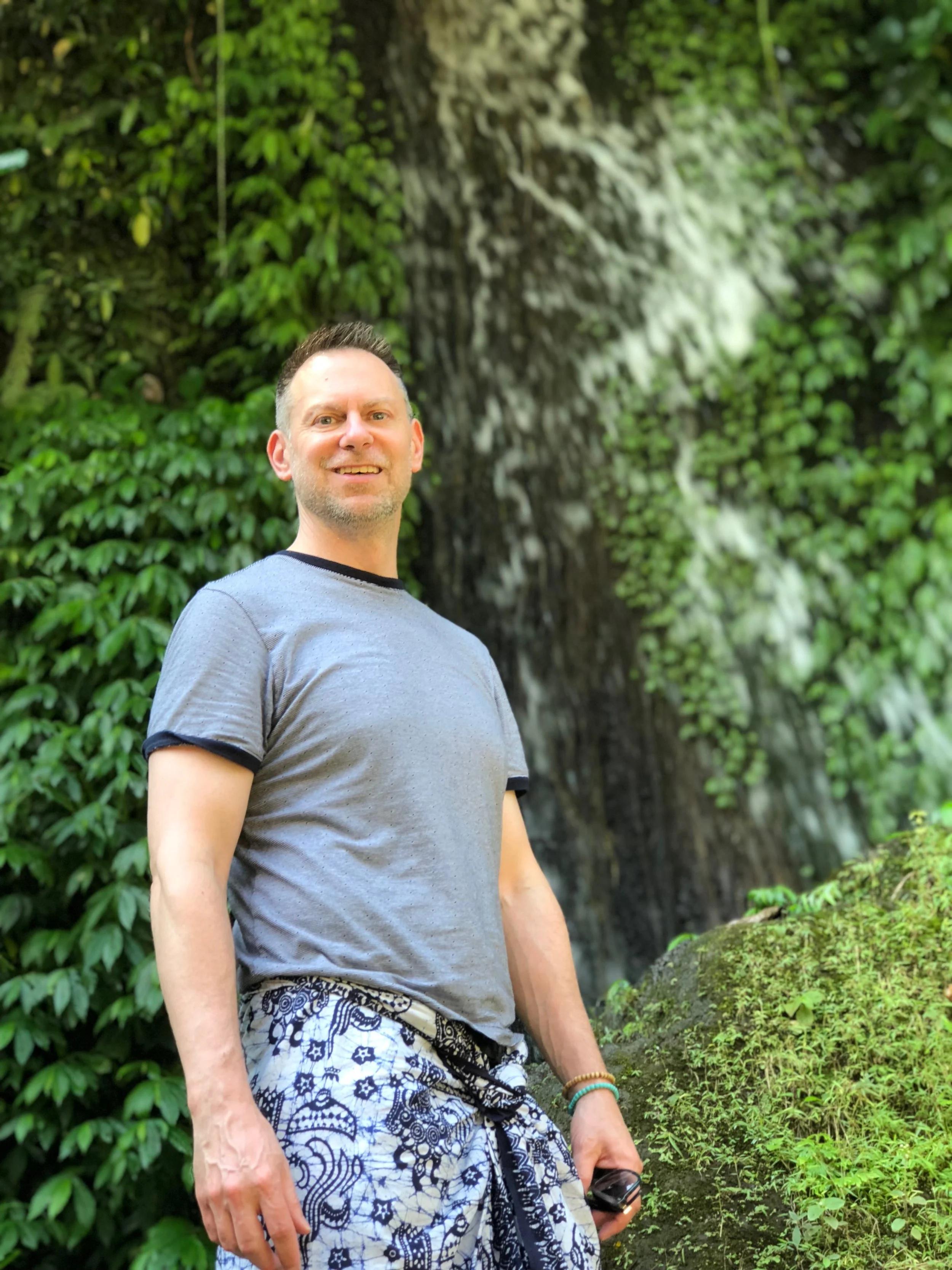 Behind Duke is the waterfall that’s across the river at one end of the complex