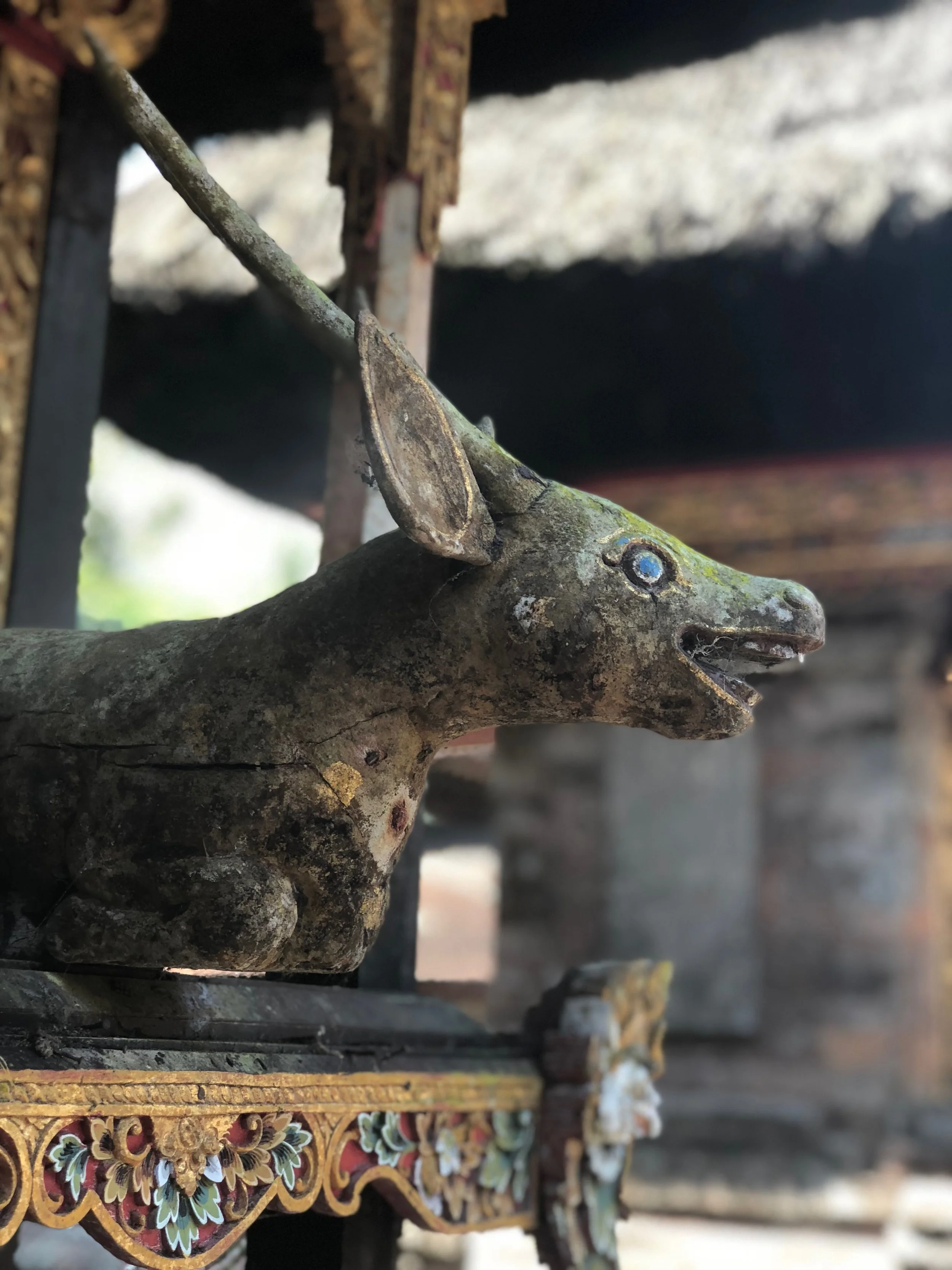 A wooden effigy of a deer