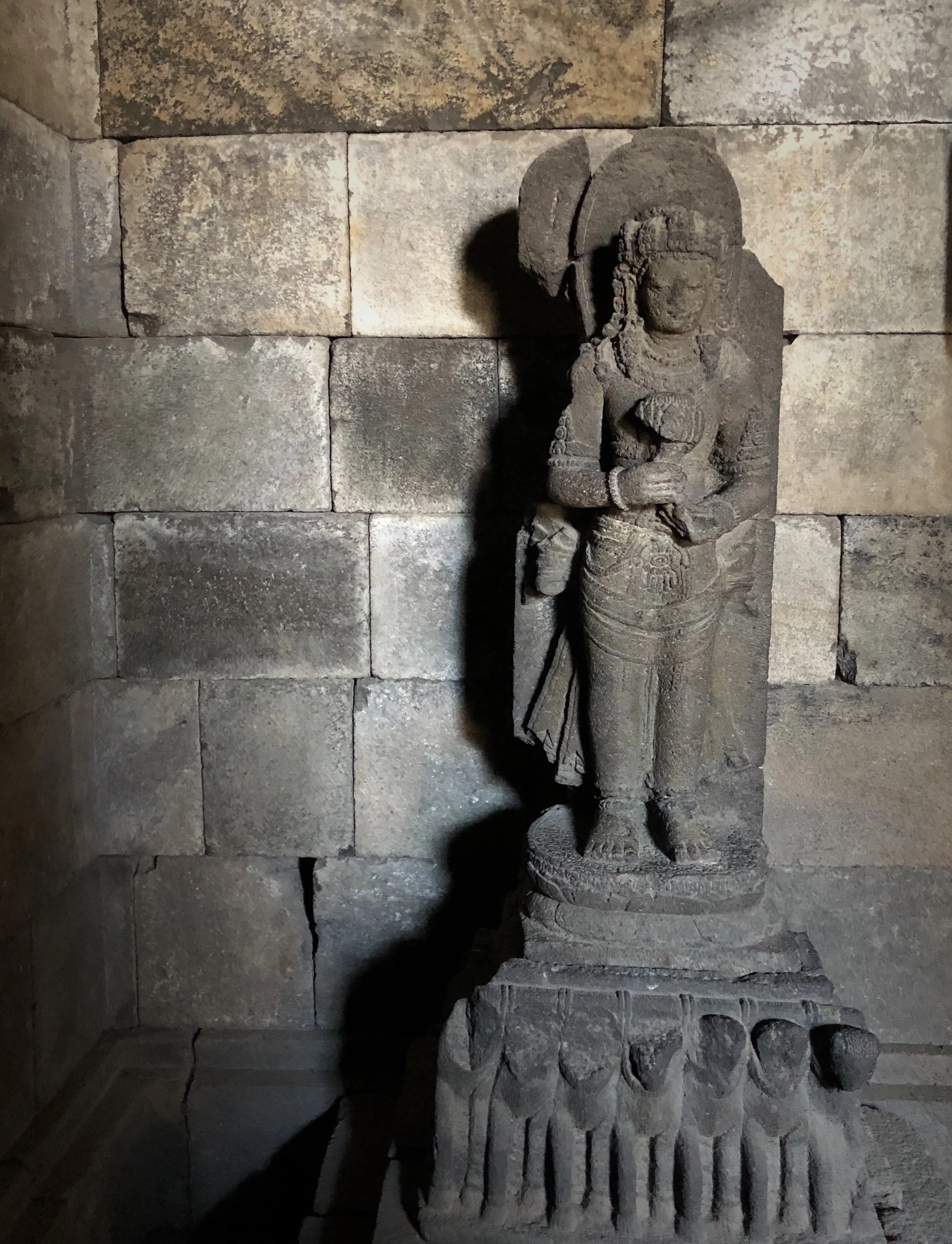 Surya, the god of the sun, stands on a chariot drawn by seven horses