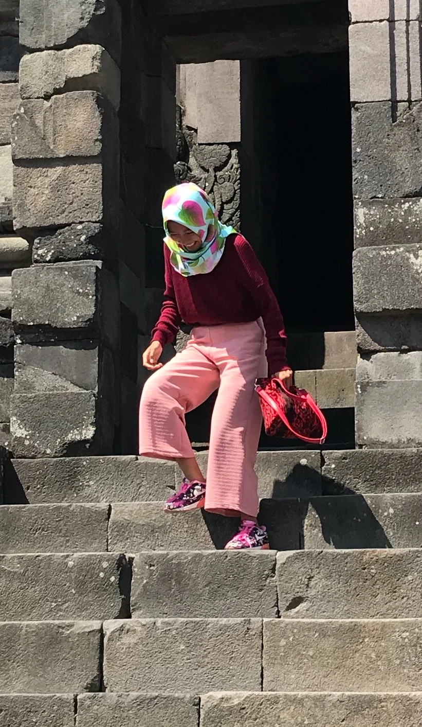 Pretty in pink: An Indonesian woman enjoys her visit