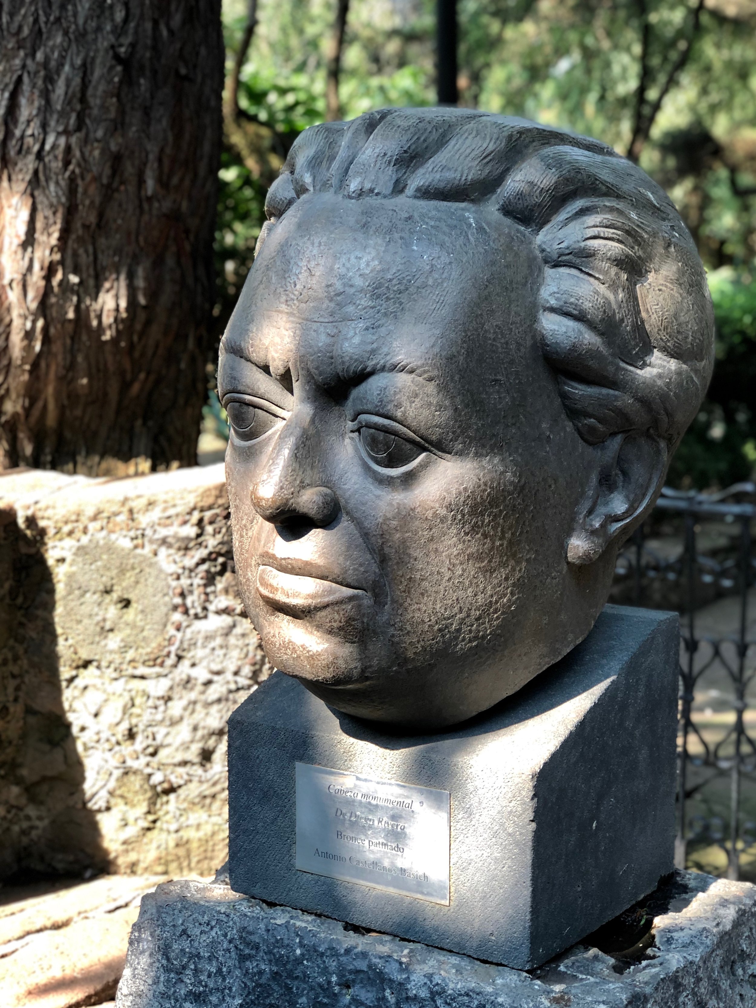 A large bust of Diego sits in the gardens