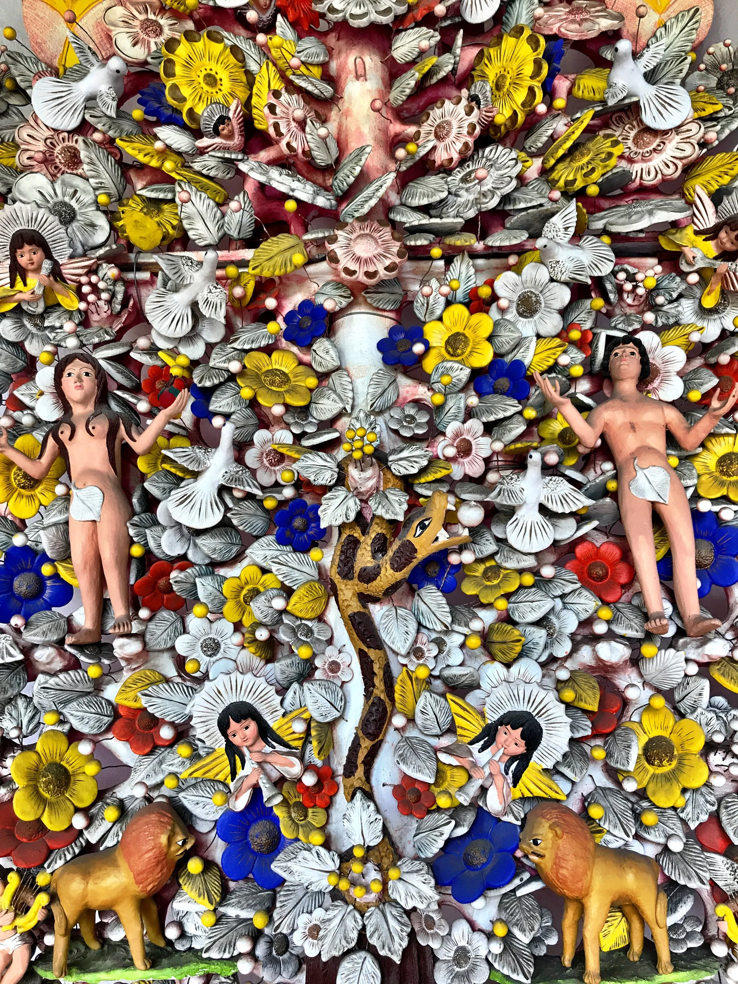 Adam and Eve are depicted on this massive Tree of Life, a common theme reflected in traditional Mexican folk art