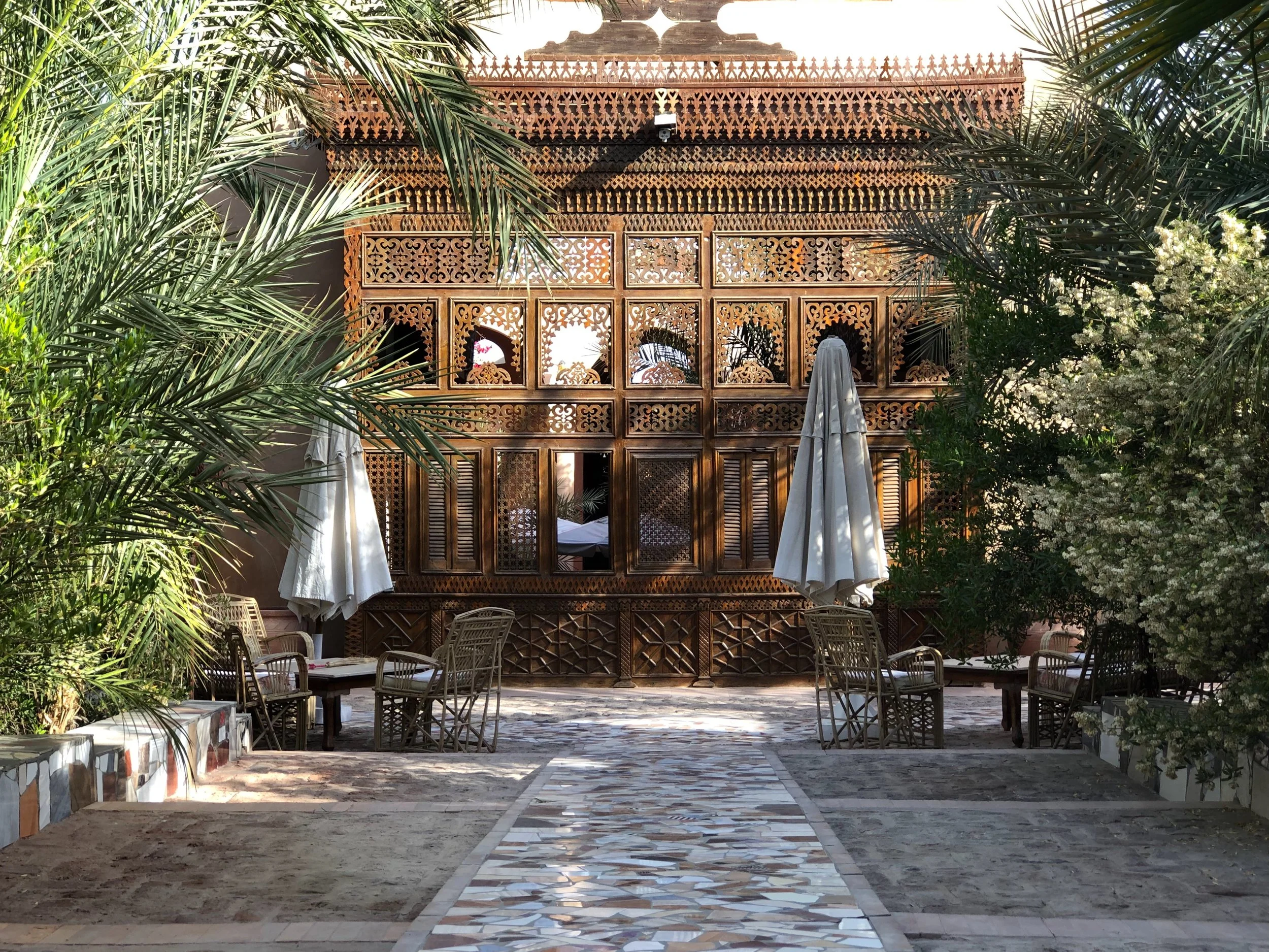 This elaborate woodwork forms one wall of the central courtyard
