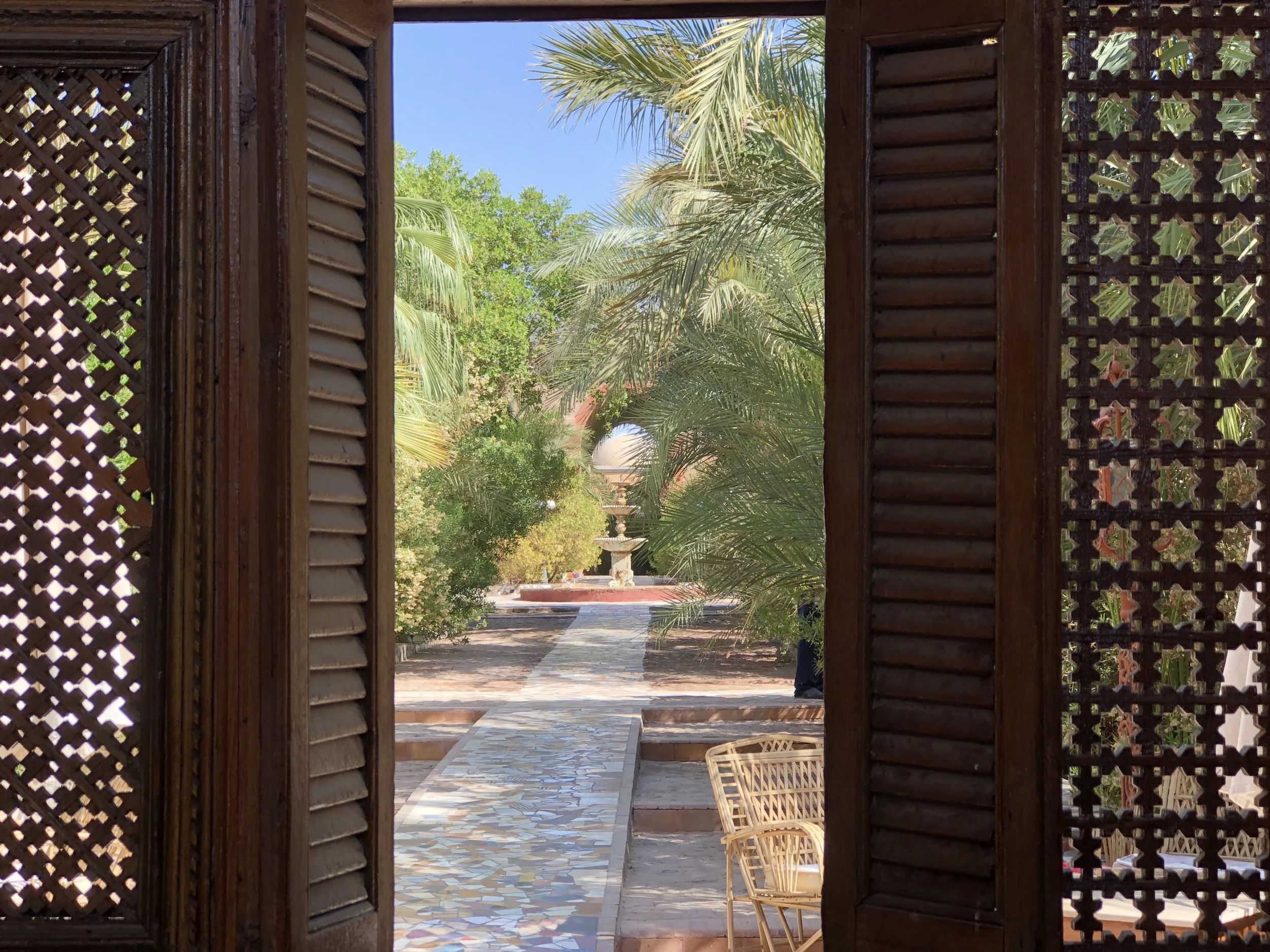 Garden paths made of repurposed tile meander throughout Al Moudira