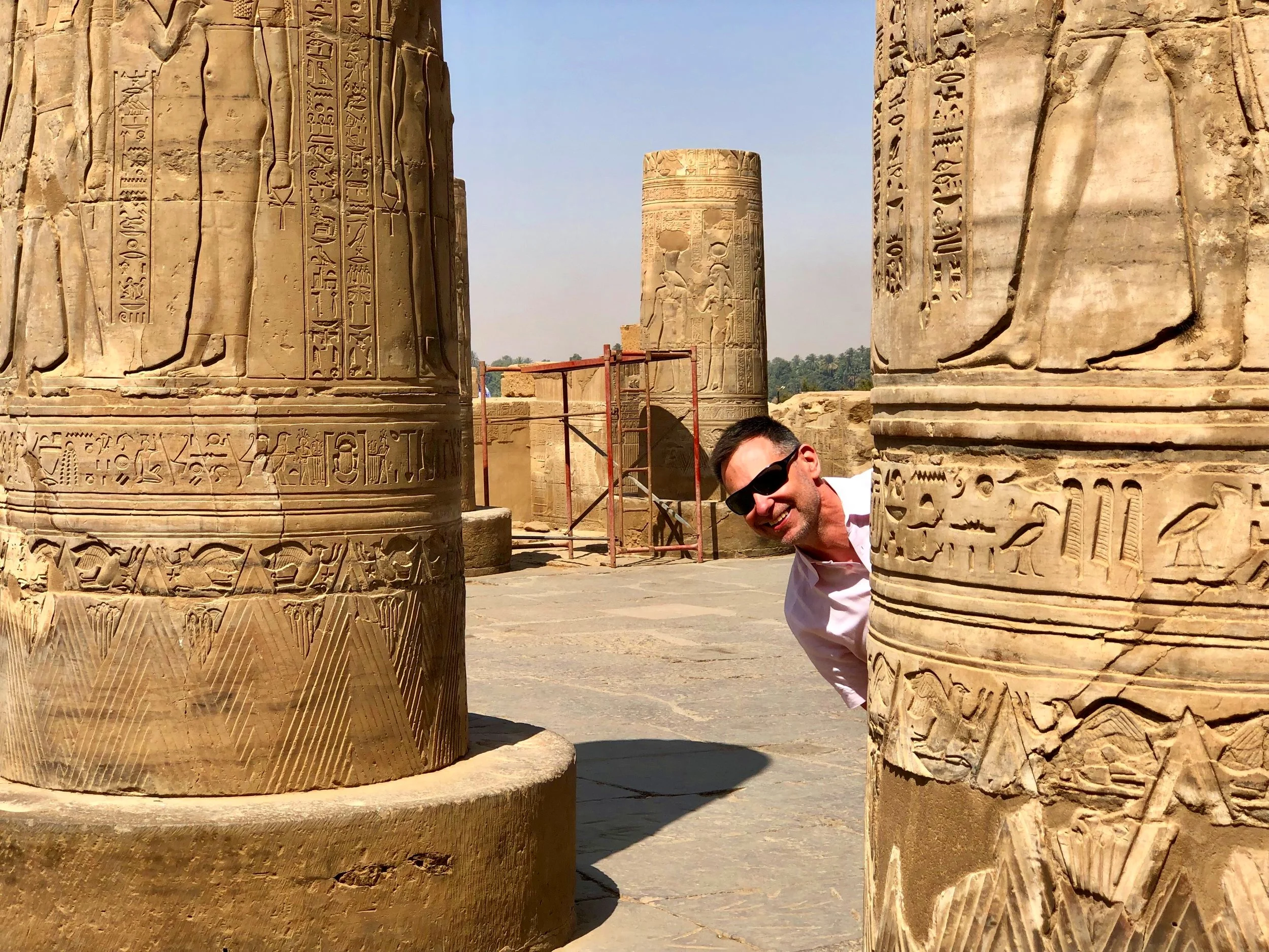 Duke peeks from behind a column in the forecourt of Kom Ombo
