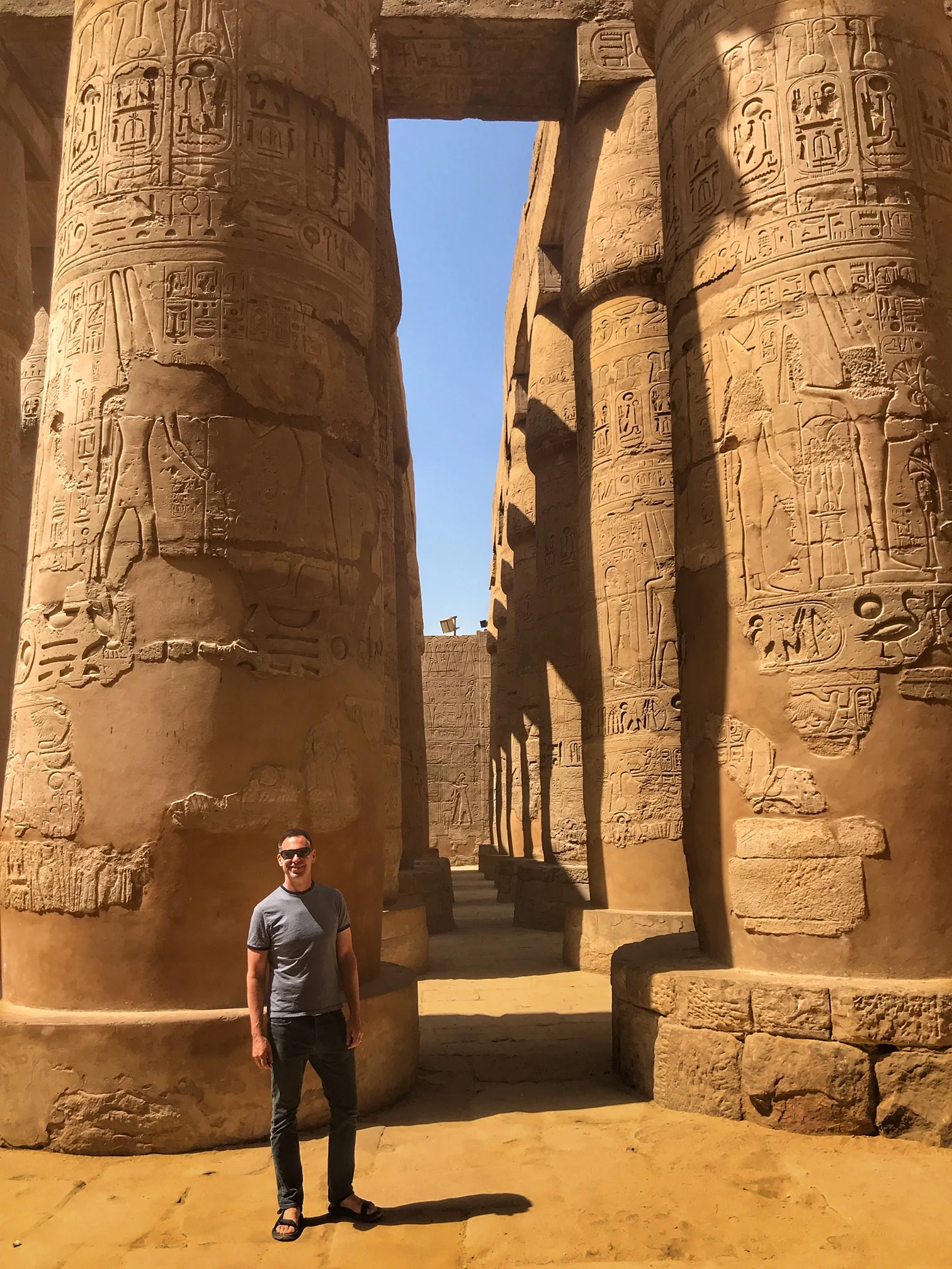 Duke stands in the ruins of Karnak Temple, a massive complex that Hatshepsut helped build (and, as such, once sported countless depictions of the female king)