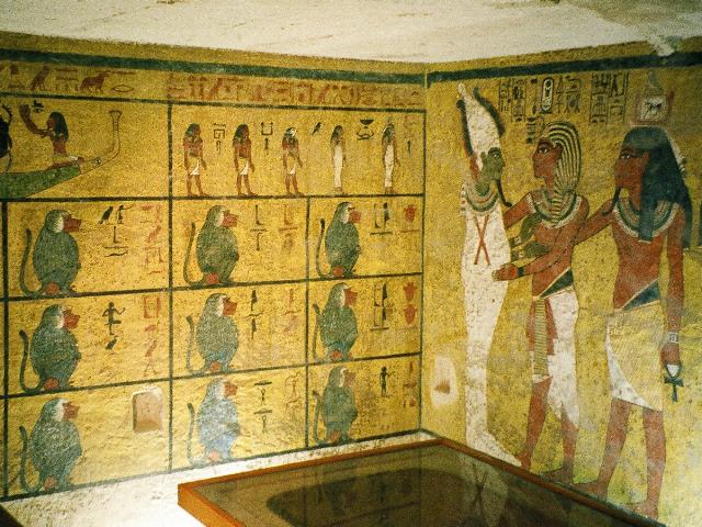 On the wall to the right, Tut is shown with his ka, or embodied soul, worshipping Osiris, the mummified god of the afterlife