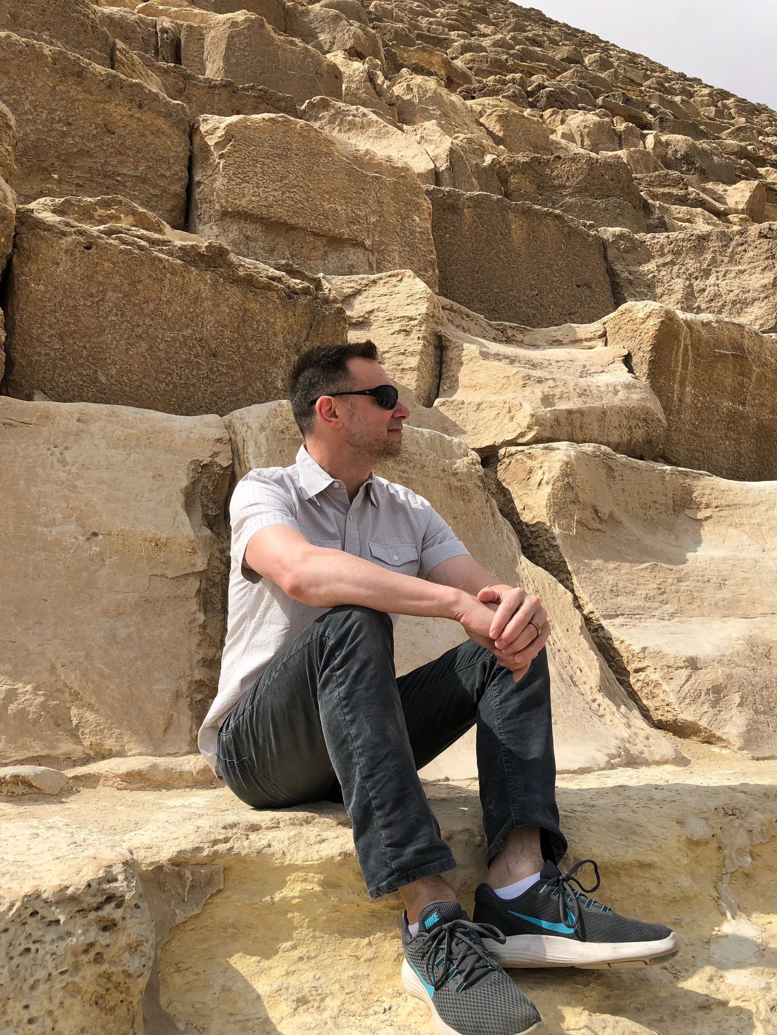 Duke sits at the base of the Great Pyramid. Wally says the pyramids are full-on Monets: gorgeous from afar…but a big old mess when you get up close