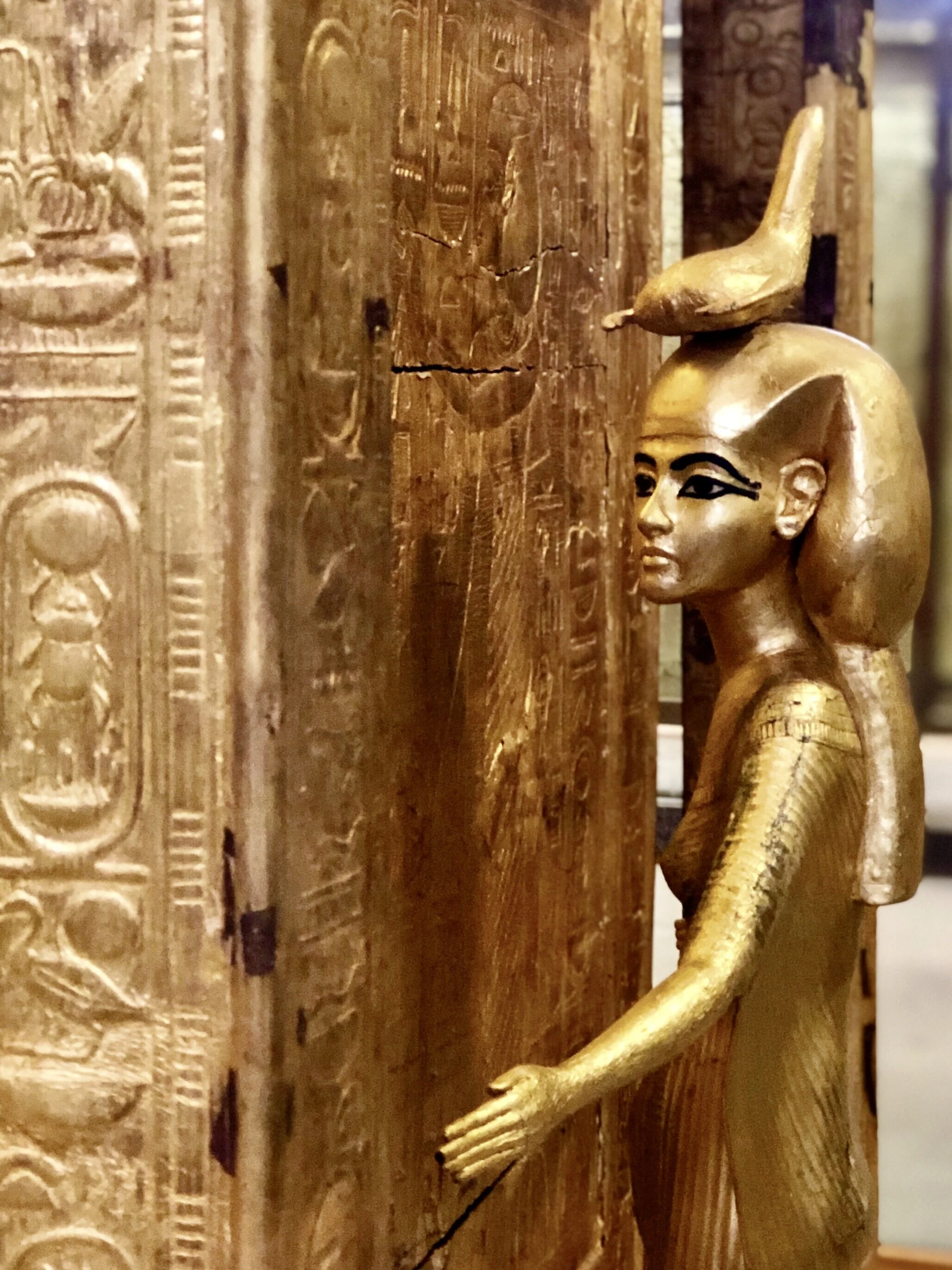 A gilded shrine shows a lesser-known deity, Selket, the goddess of magic, who wore a scorpion atop her head