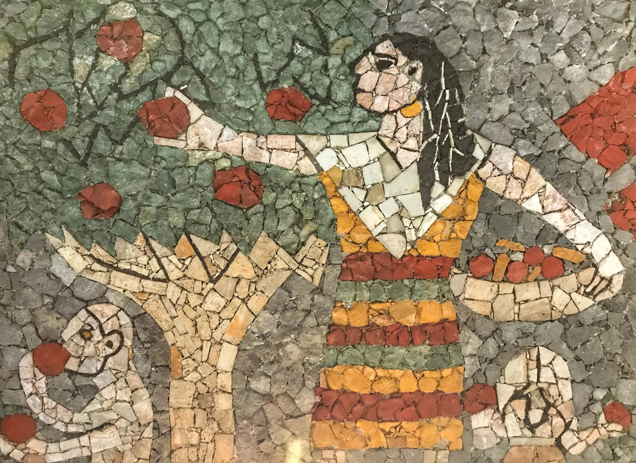 A woman gathers fruit in one ceiling mural.