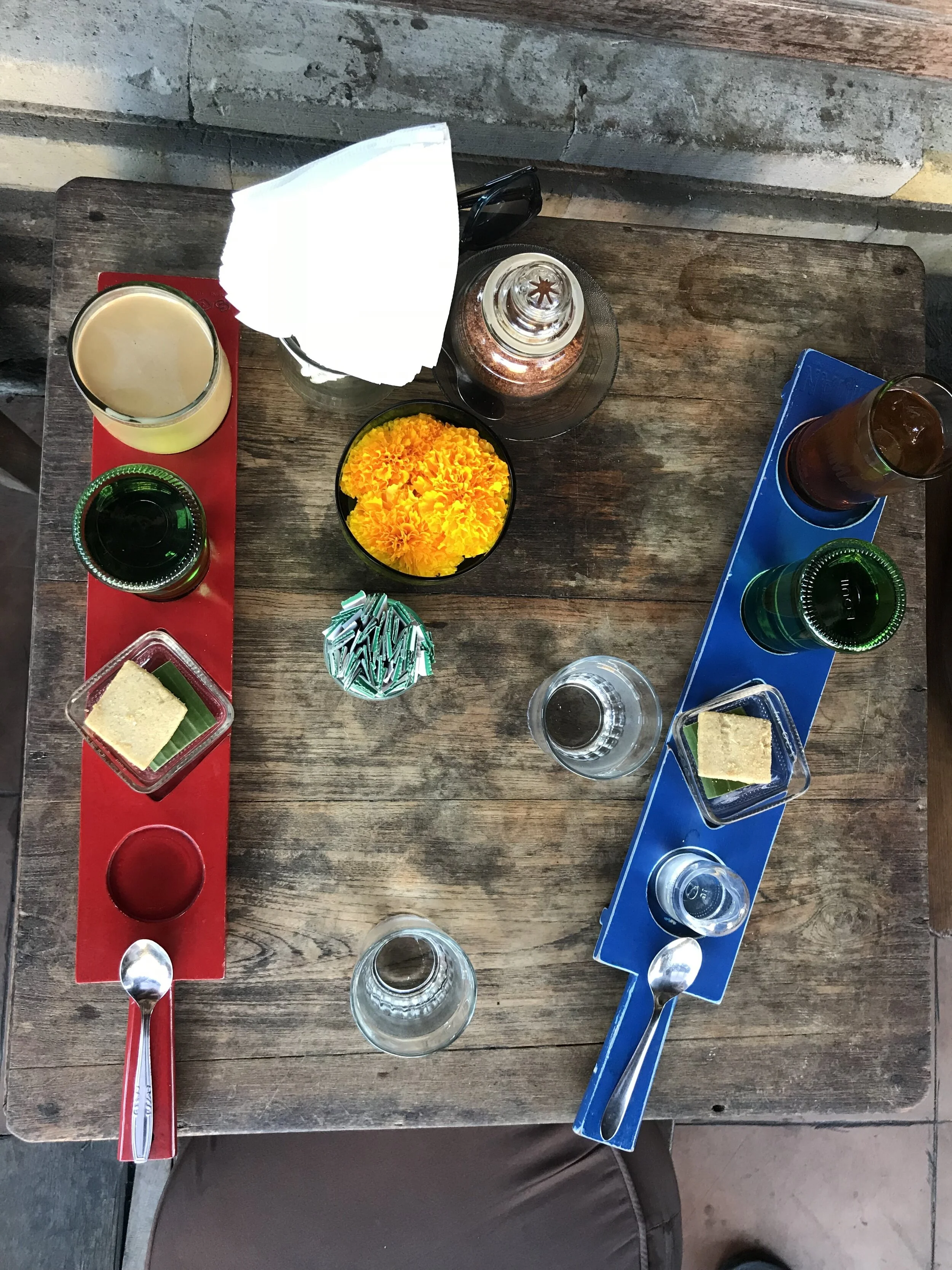 The drinks come on colorful paddles with slots for simple syrup and a sweet treat.