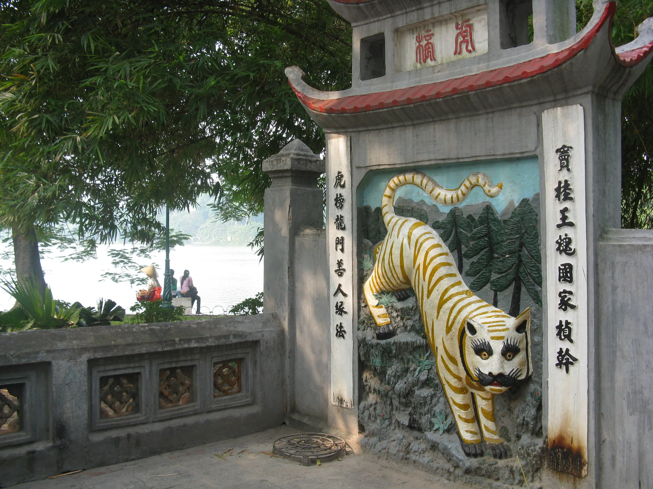 The second gate has a tiger on one side, the symbol of female protection (e.g., tiger moms).