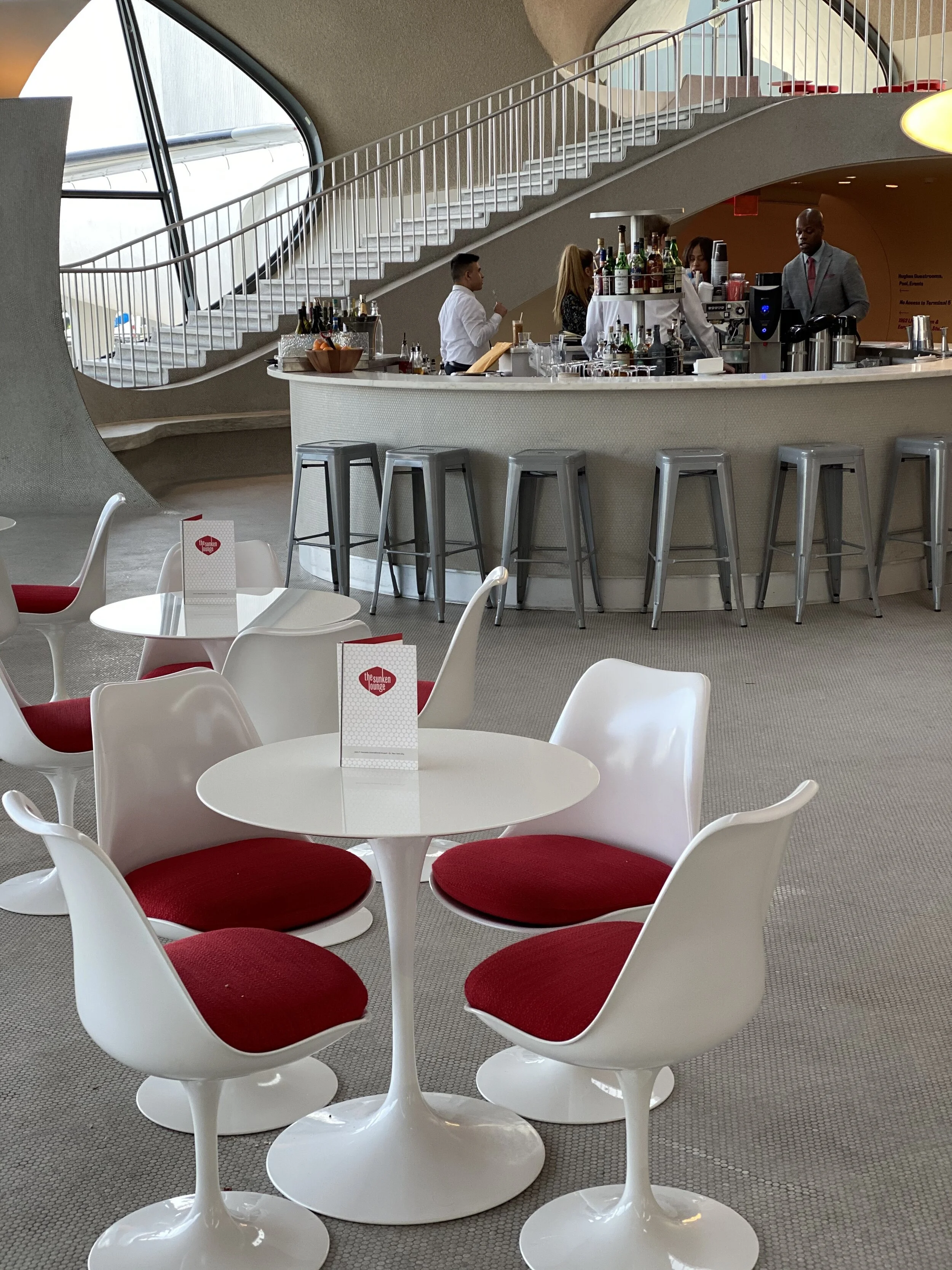 Saarinen designed the Tulip chairs and pedestal tables found throughout the space.
