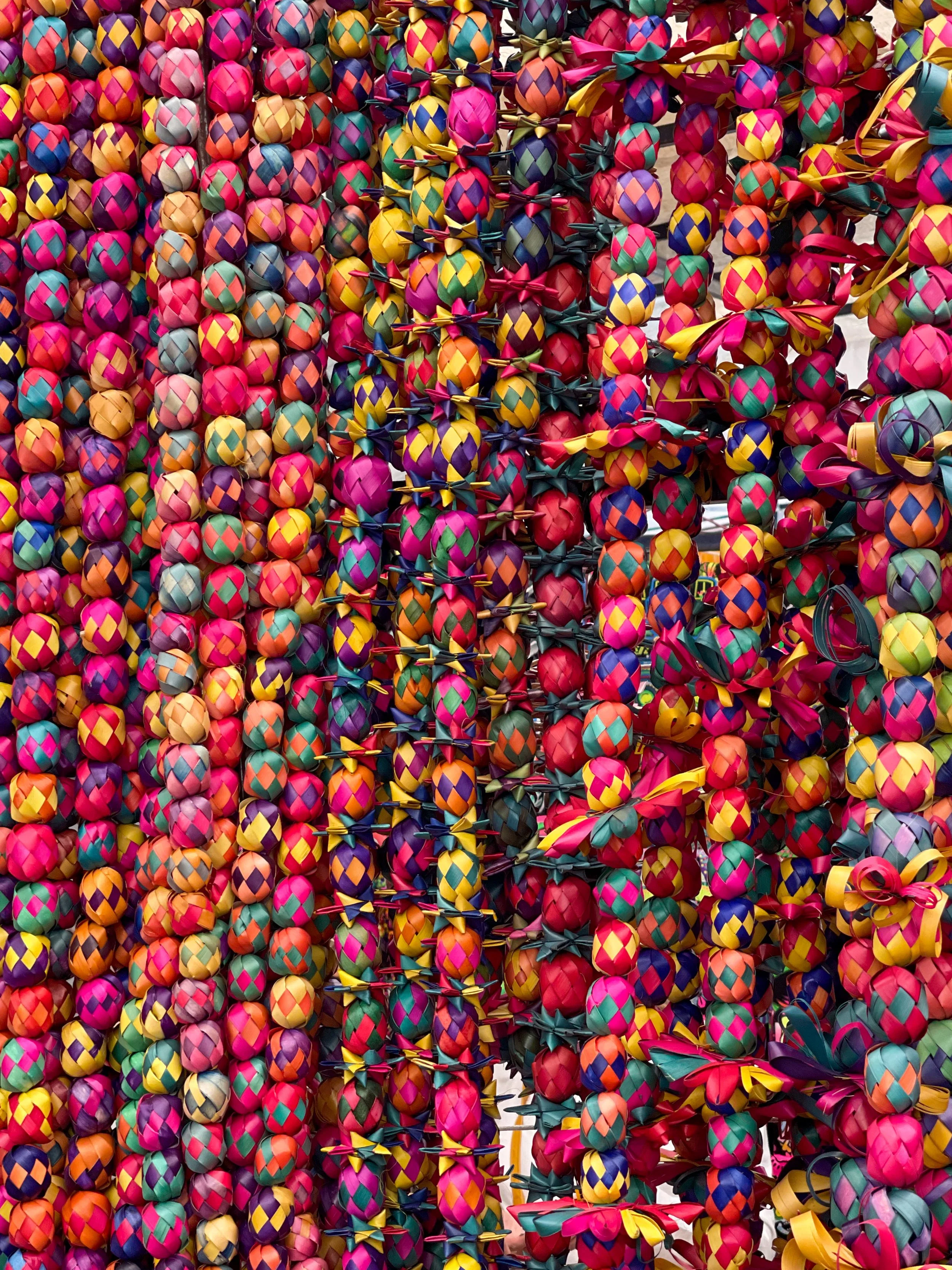Colorful woven garlands at the Bazar Sábado